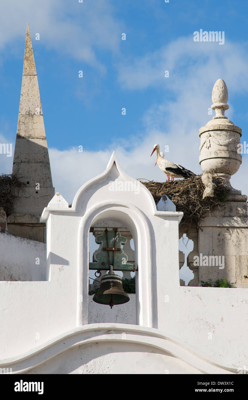 Storks nesting on the Arco Da Vila Farol, Algarve, Portugal Stock Photo
