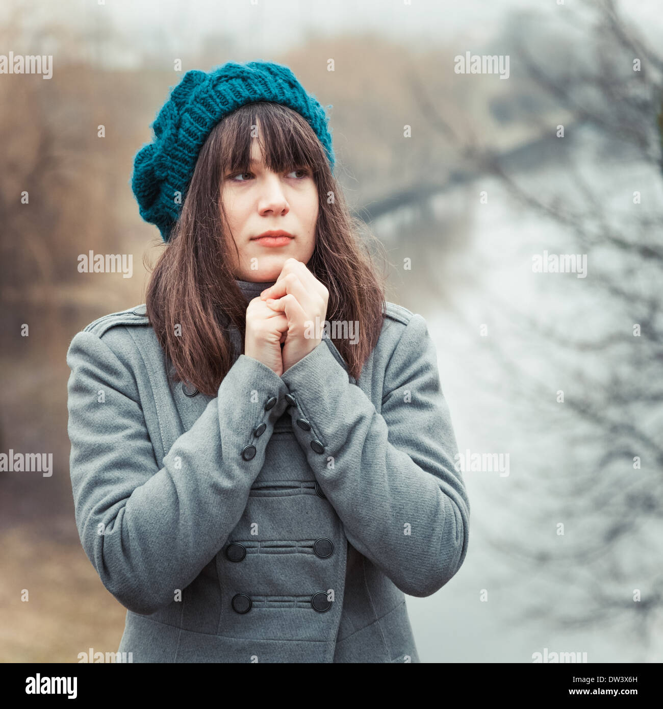young pretty girl in cold weather in park outdoors, vintage portrait Stock Photo