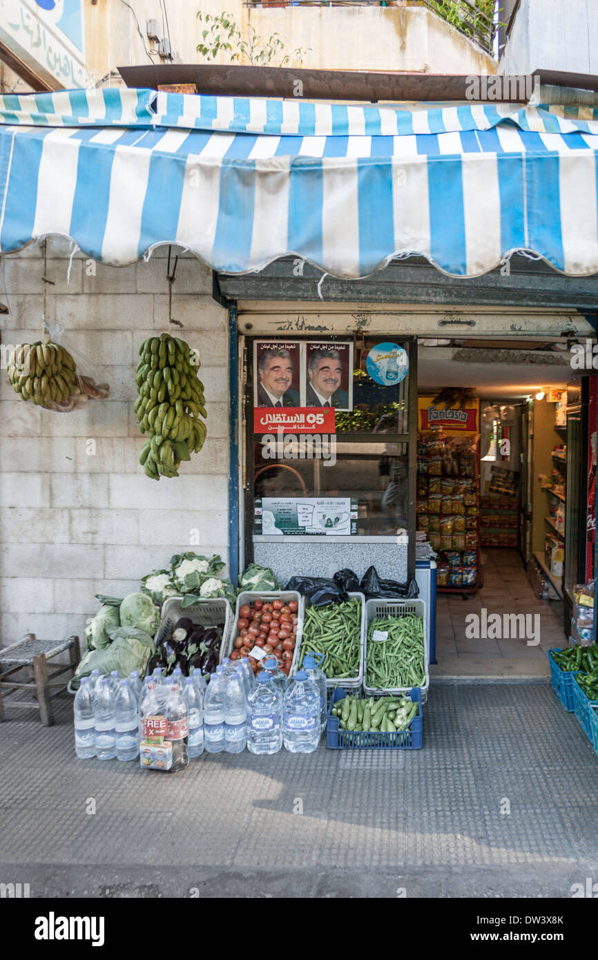 Fruit and vegetable store with photos of assassinated Prime Minister Rafik Hariri in Beirut, Lebanon. Stock Photo
