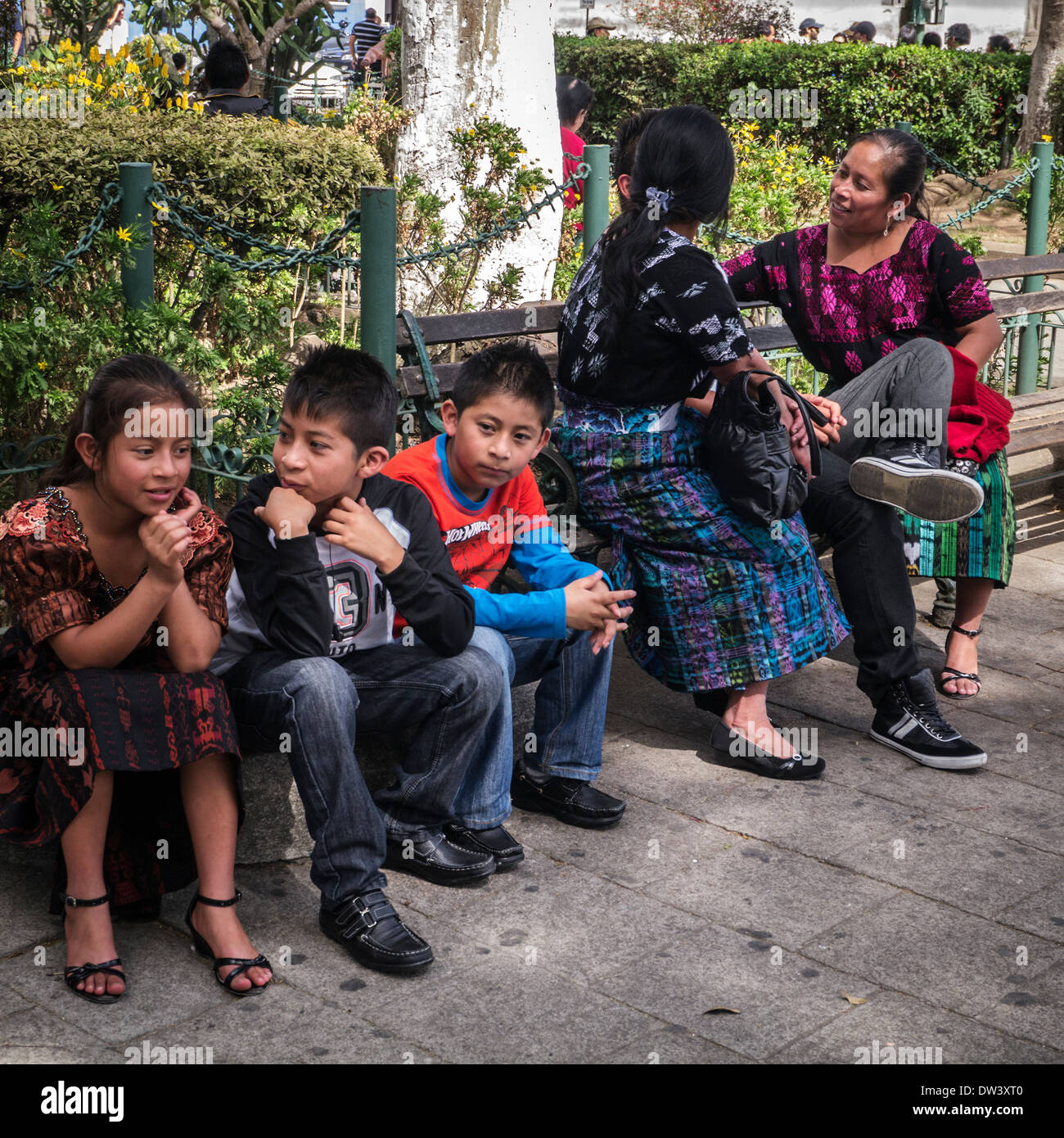 Maya Indians enjoying the Zocalo square, Antigua, Guatemala, Latimn America Stock Photo