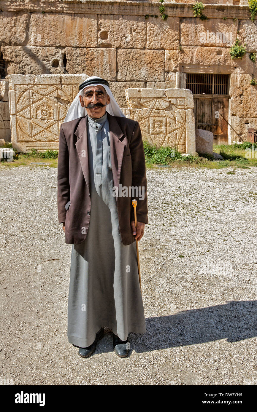 Bedouin man in traditional dress standing in the Roman ruins of Baalbek, Lebanon. Stock Photo