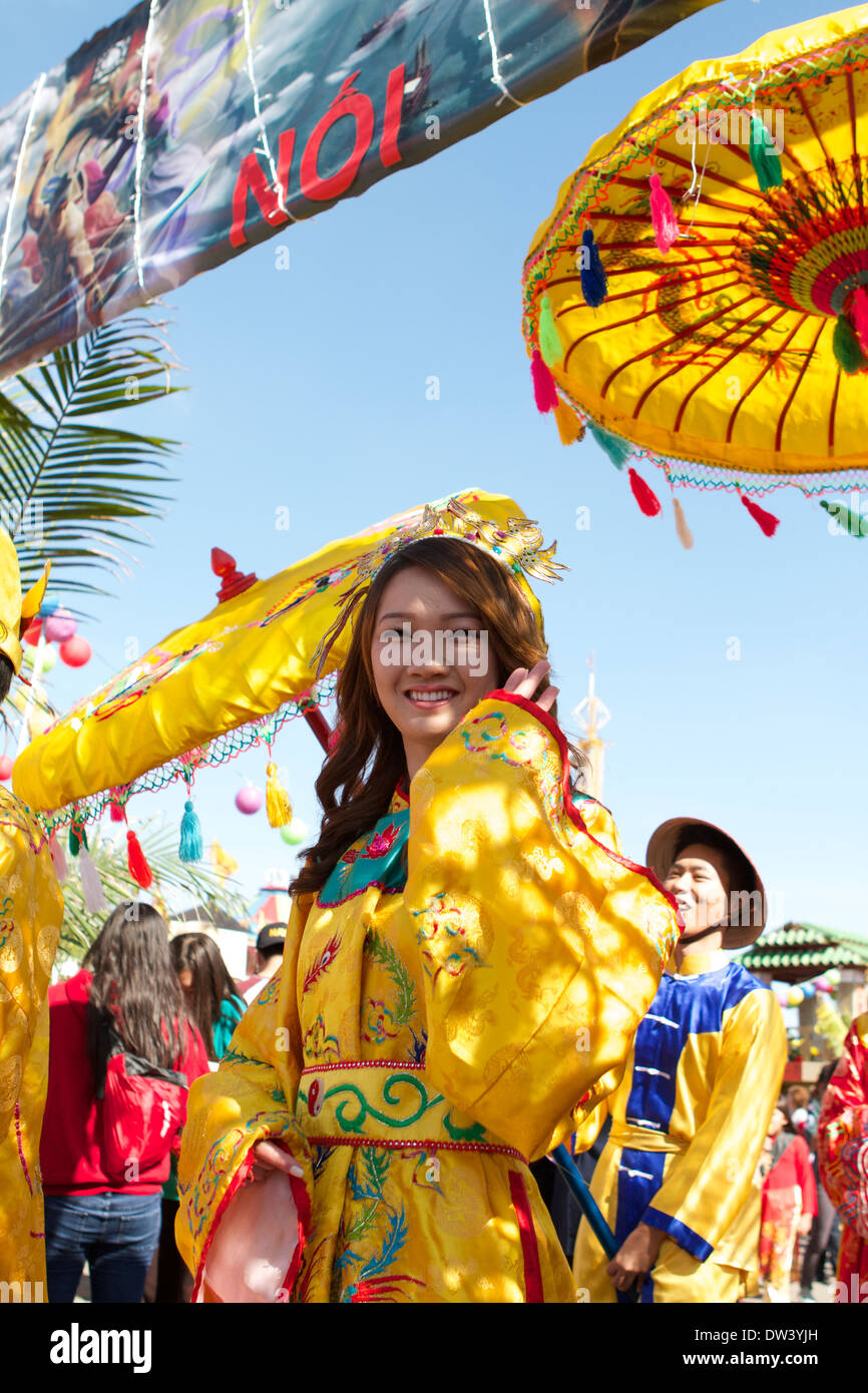 Vietnamese woman in traditional dress celebrating the Tet Festival