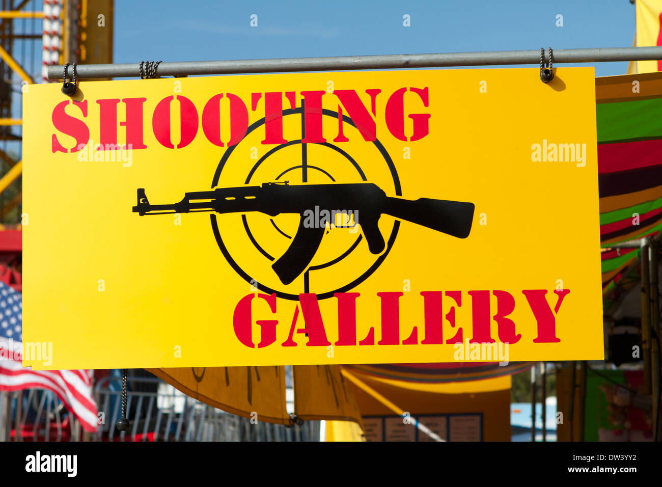 Fair ground shooting gallery sign with rifle pointing the way Stock Photo Alamy