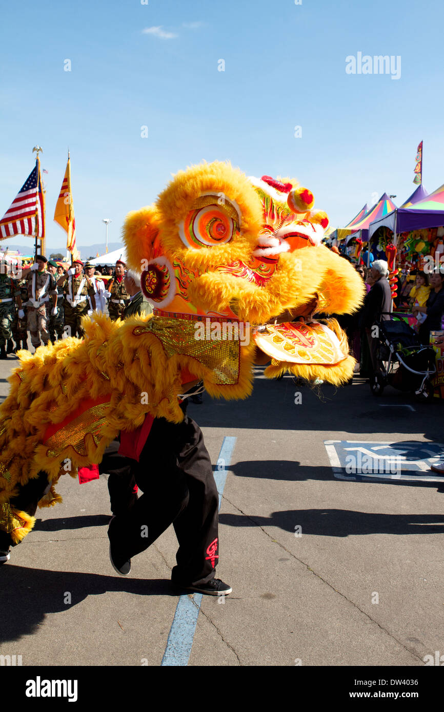 Traditional Vietnamese Lion dance performed at a Tet festival (lunar new year)  California supposedly to ward off evil spirits Stock Photo