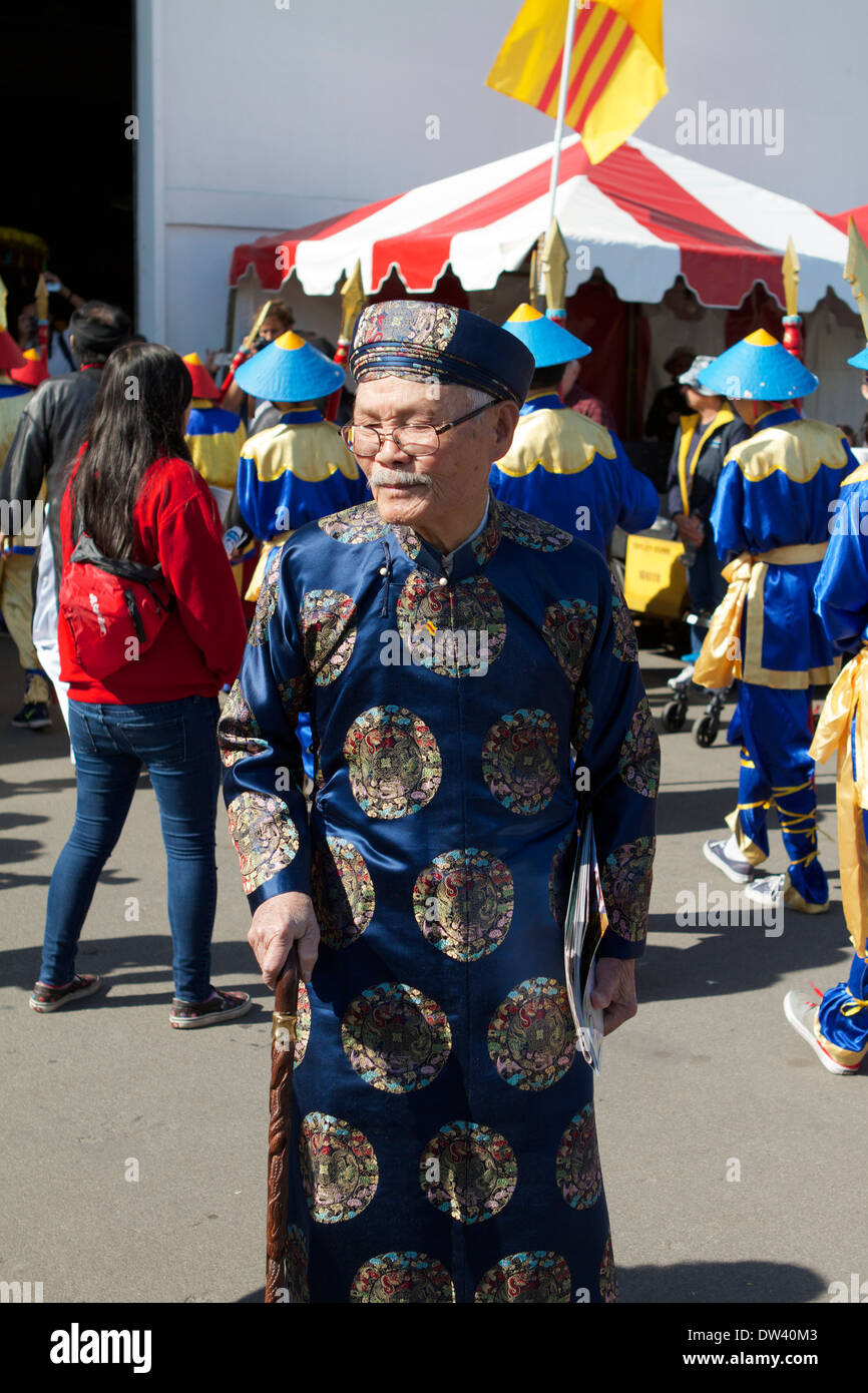 Senior Vietnamese man in traditional costume celebrating the Tet