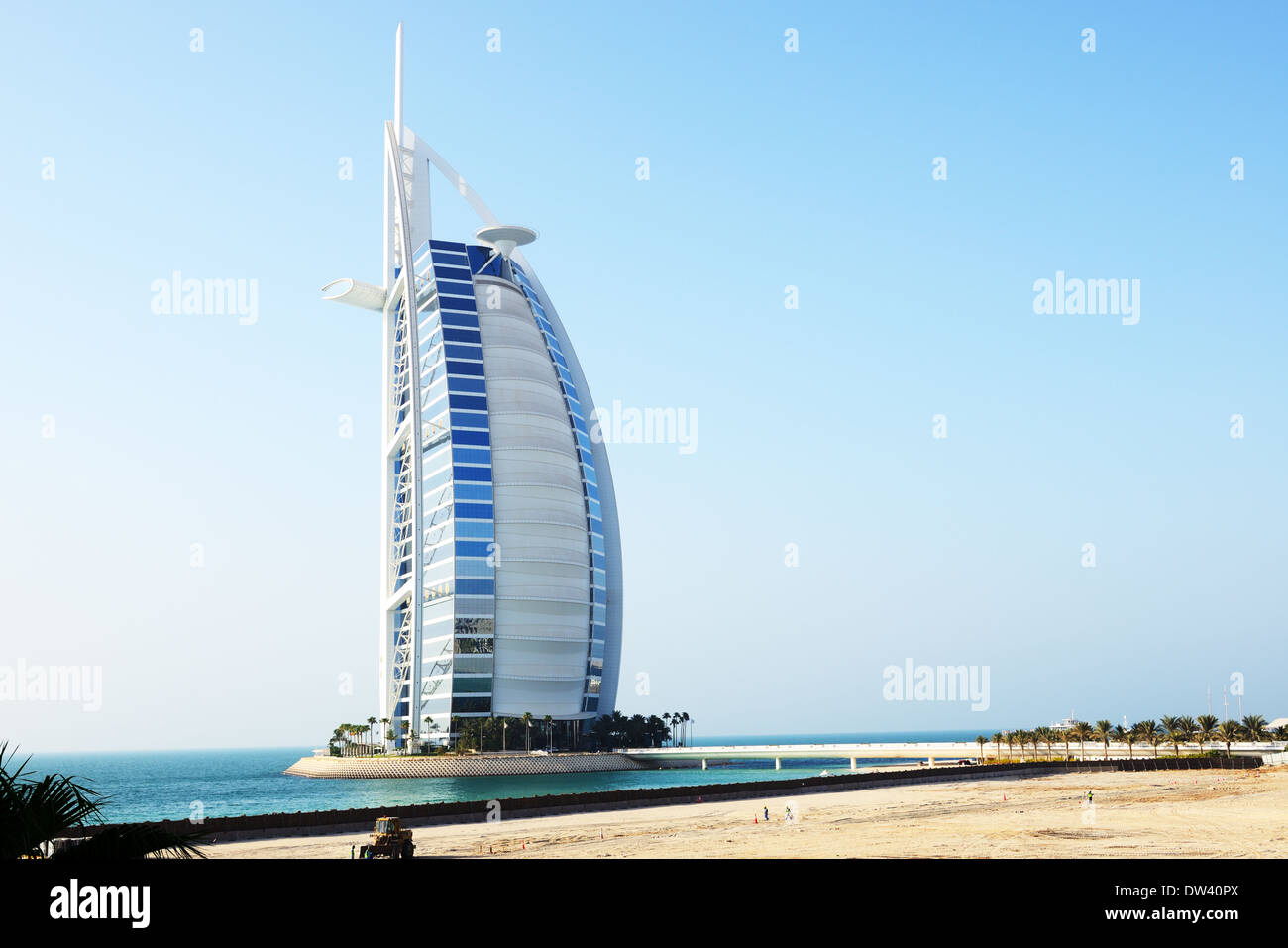 The view on world's first seven stars luxury hotel Burj Al Arab 'Tower of the Arabs' and construction site for a new hotel Stock Photo