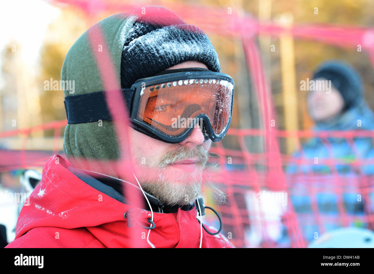 portrait of a snowboarder in goggles and mask Stock Photo