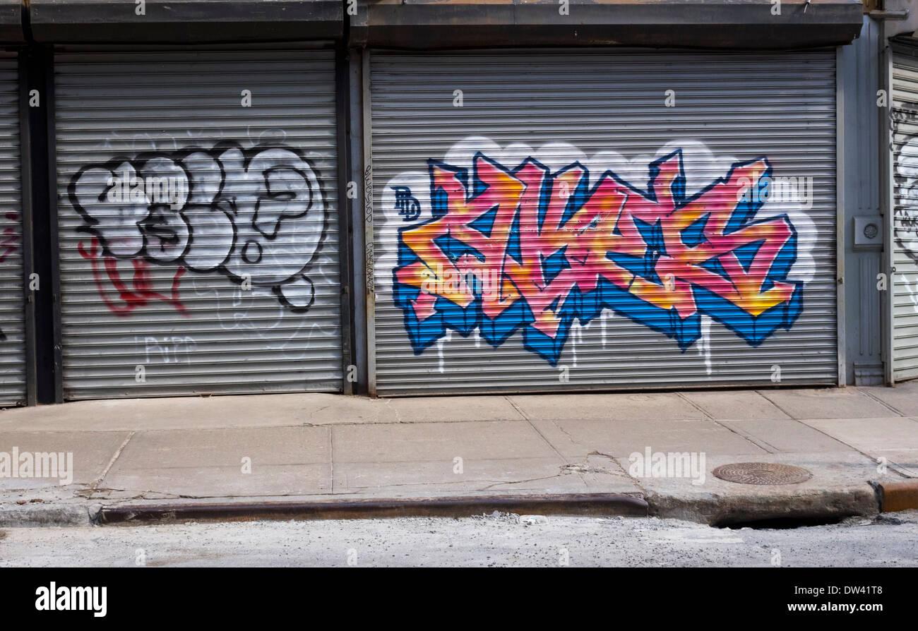 Graffiti on New York store fronts in downtown New York City Stock Photo