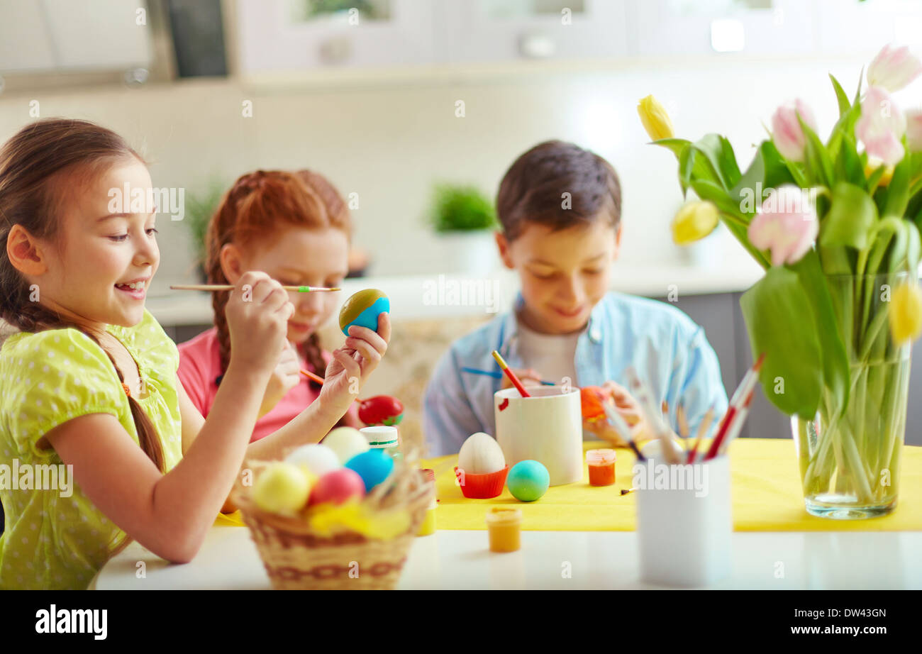 Preschoolers decorating Easter eggs Stock Photo