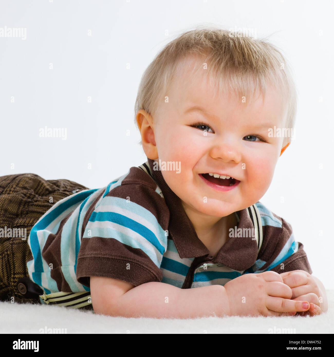 Baby boy, 16 Months old wearing striped shirt and suspenders, white background Stock Photo Alamy