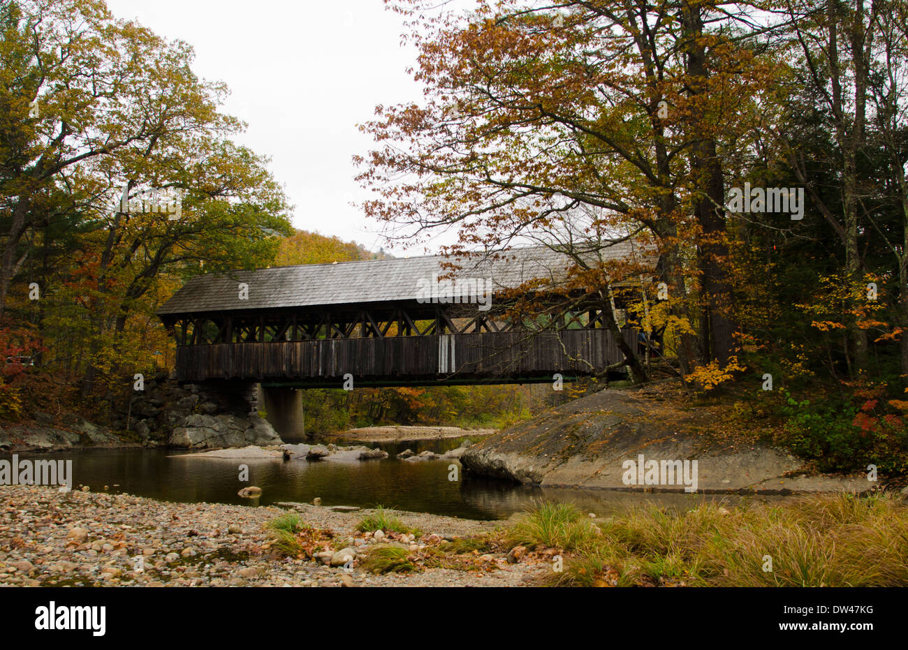 Bethel Maine Newry covered bridge with river in Northern New England in leaf peeping October fall foliage Stock Photo