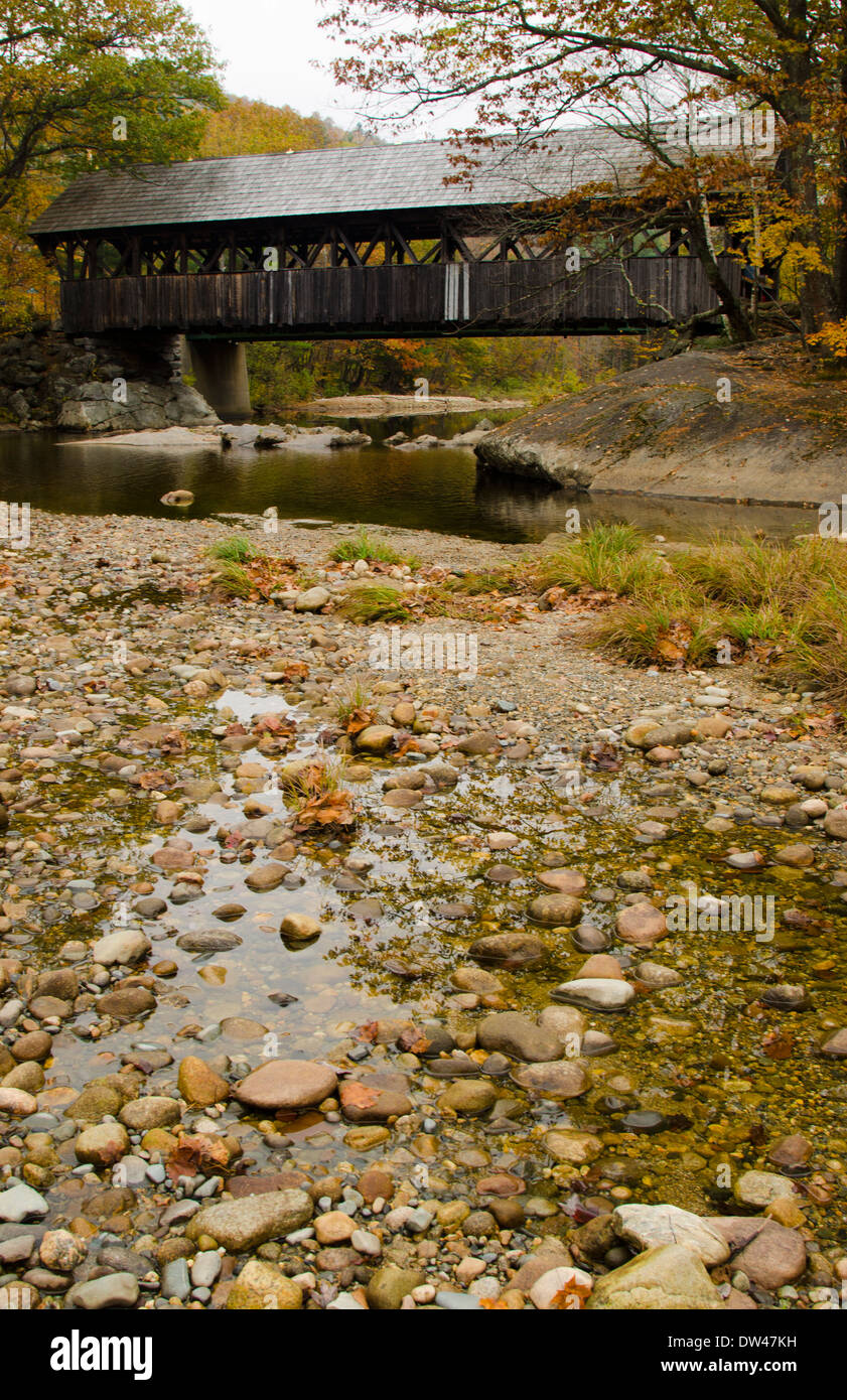 Bethel Maine Newry covered bridge with river in Northern New England in leaf peeping October fall foliage Stock Photo