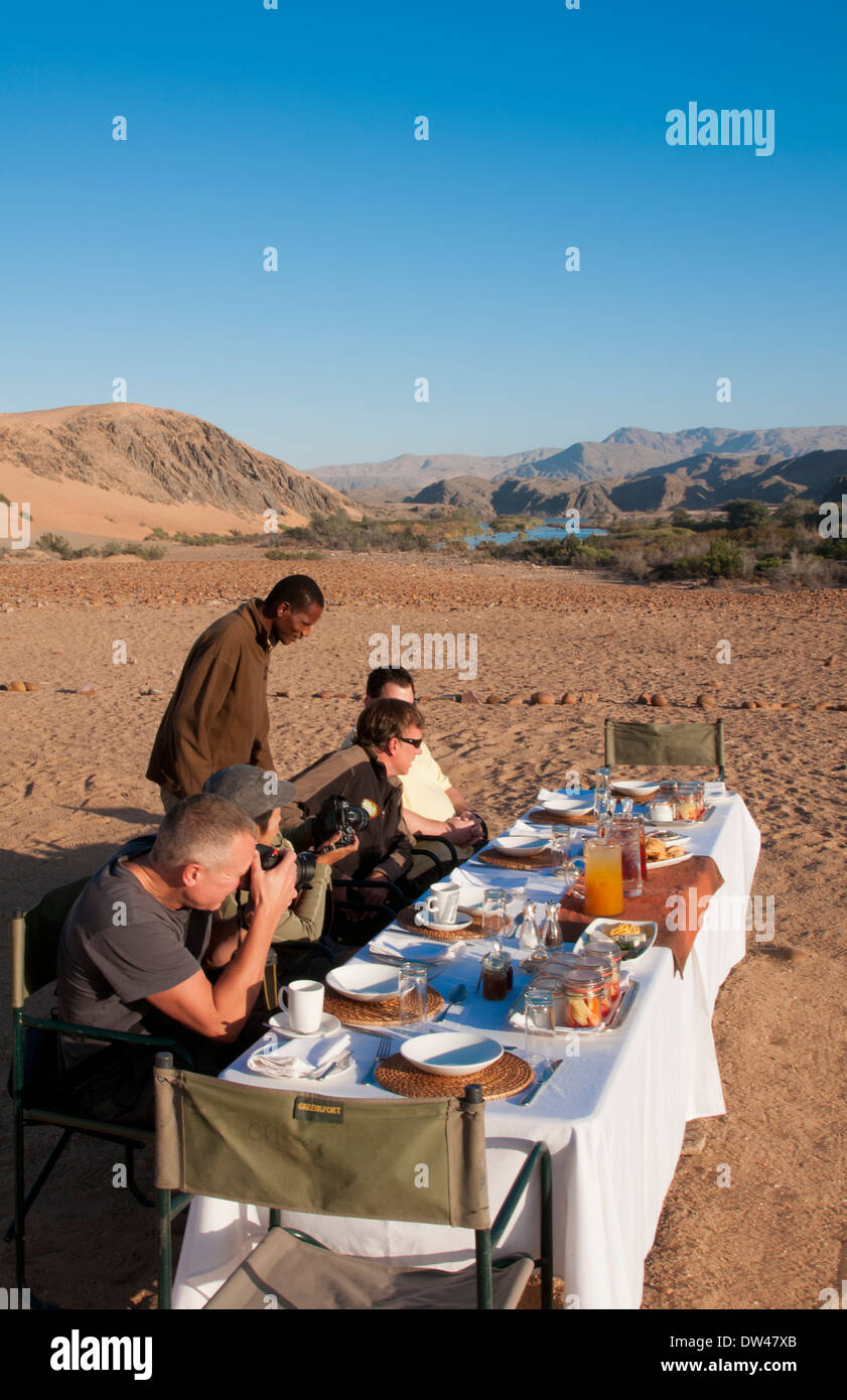 Namibia Africa Northern Desert of Namib Desert border of Angola and Kunene River safari with lunch on river with table Stock Photo