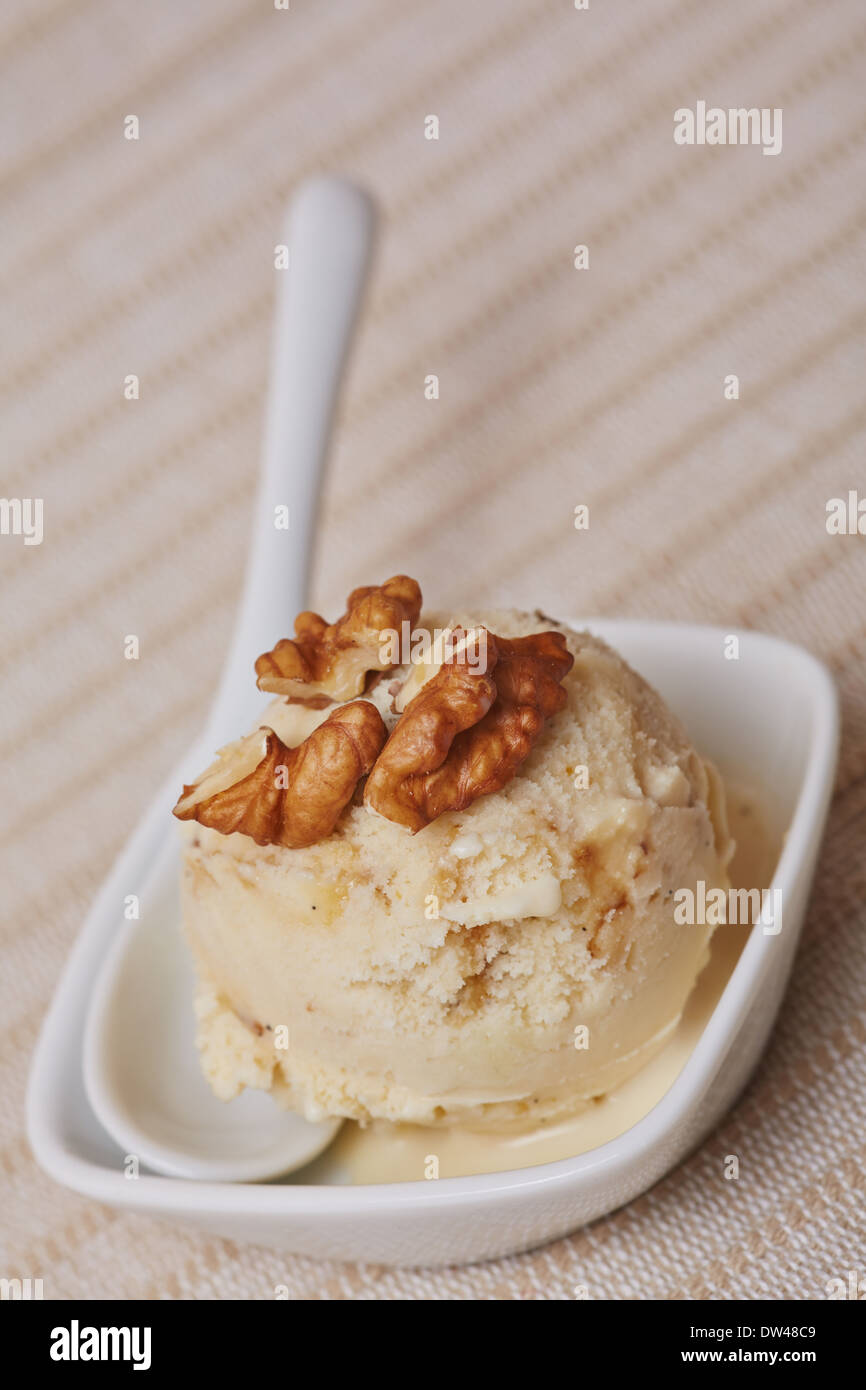 A scoop of homemade walnut ice cream with spoon Stock Photo Alamy