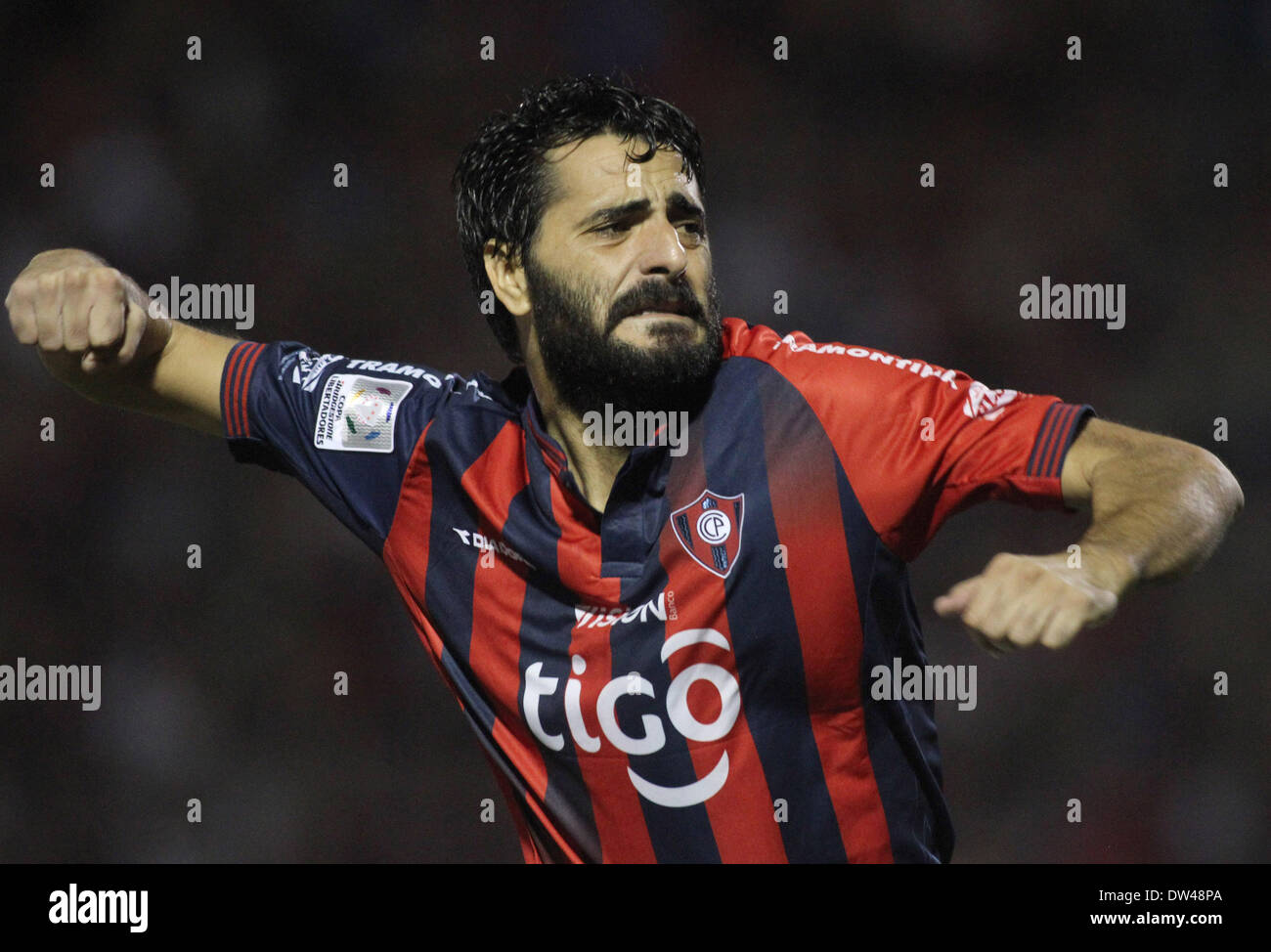 Asuncion, Paraguay. 26th Feb, 2014. Daniel Guiza of Cerro Porteno celebrates his goal during the day 2 match of group 3 of Libertadores Cup against Lanus in the Defensores del Chavo stadium, in Asucion, Paraguay, on Feb. 26, 2014. Credit:  Marcelo Espinosa/Xinhua/Alamy Live News Stock Photo