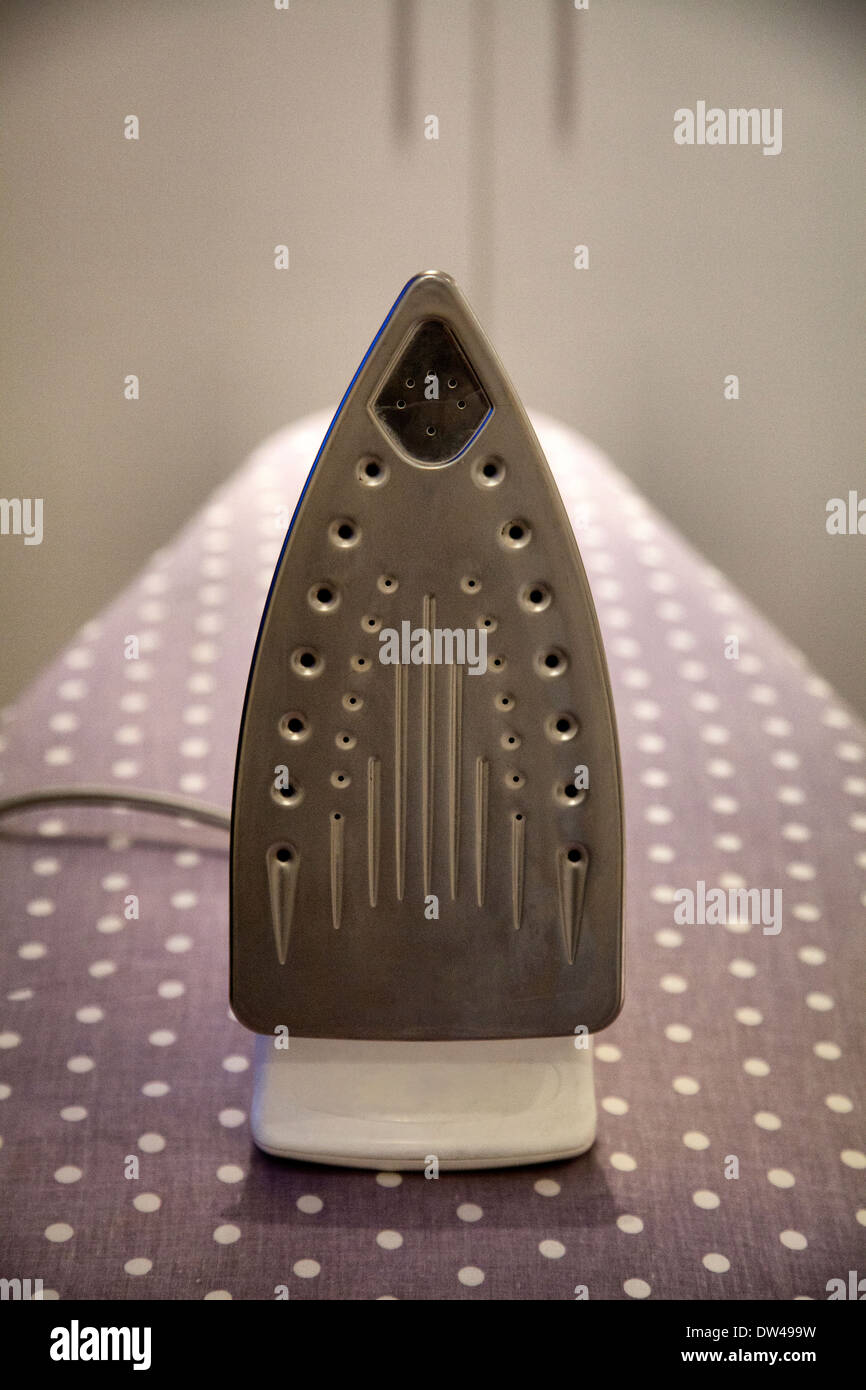Iron On Ironing Board Stock Photo Alamy