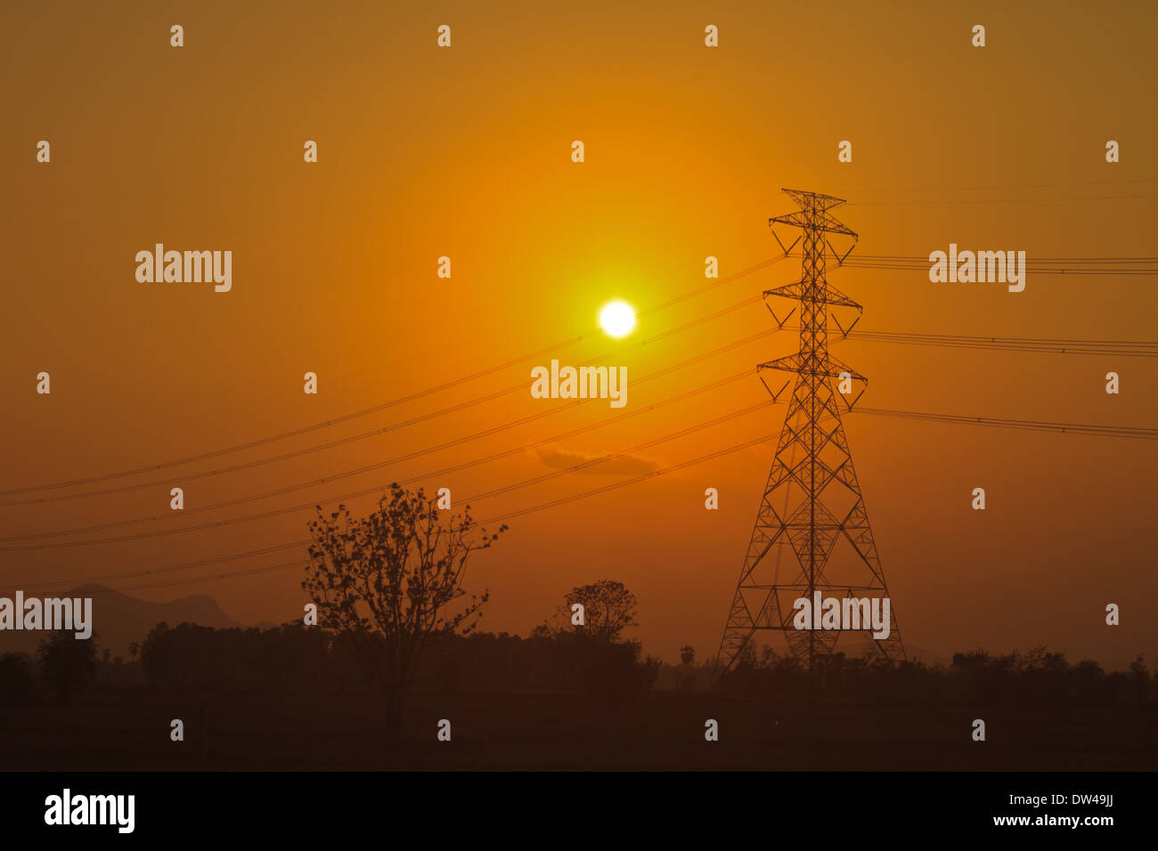 High voltage power pylons in sunset scene twilight Stock Photo - Alamy