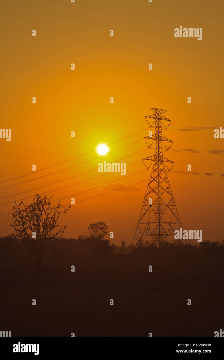 High voltage power pylons in sunset scene twilight Stock Photo - Alamy