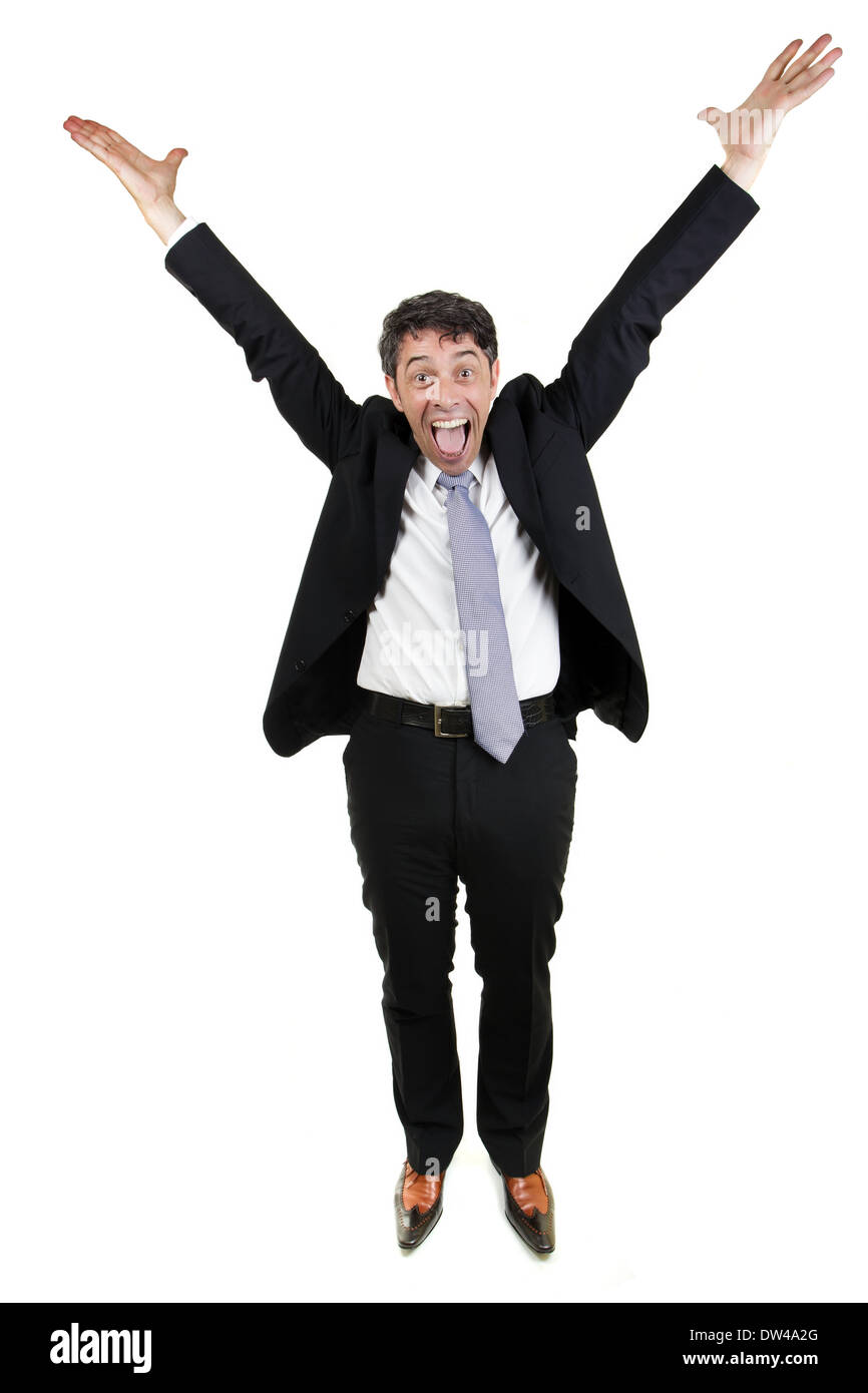 Jubilant businessman man cheering and raising his outstretched arms into the air in celebration, isolated on white Stock Photo