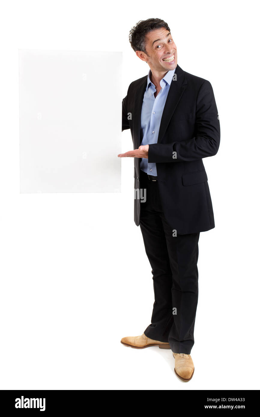 Salesman with a blank white rectangular placard with copyspace for your text or advertisement holding it to the side Stock Photo