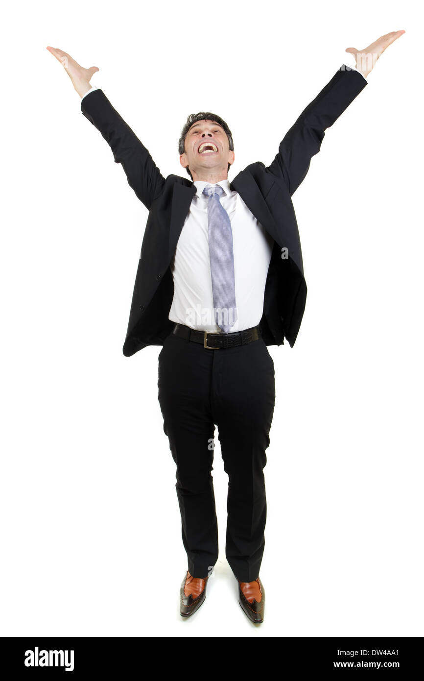 Jubilant businessman rejoicing an achievement stretching his arms in the air and cheering in excitement and elation, full body p Stock Photo