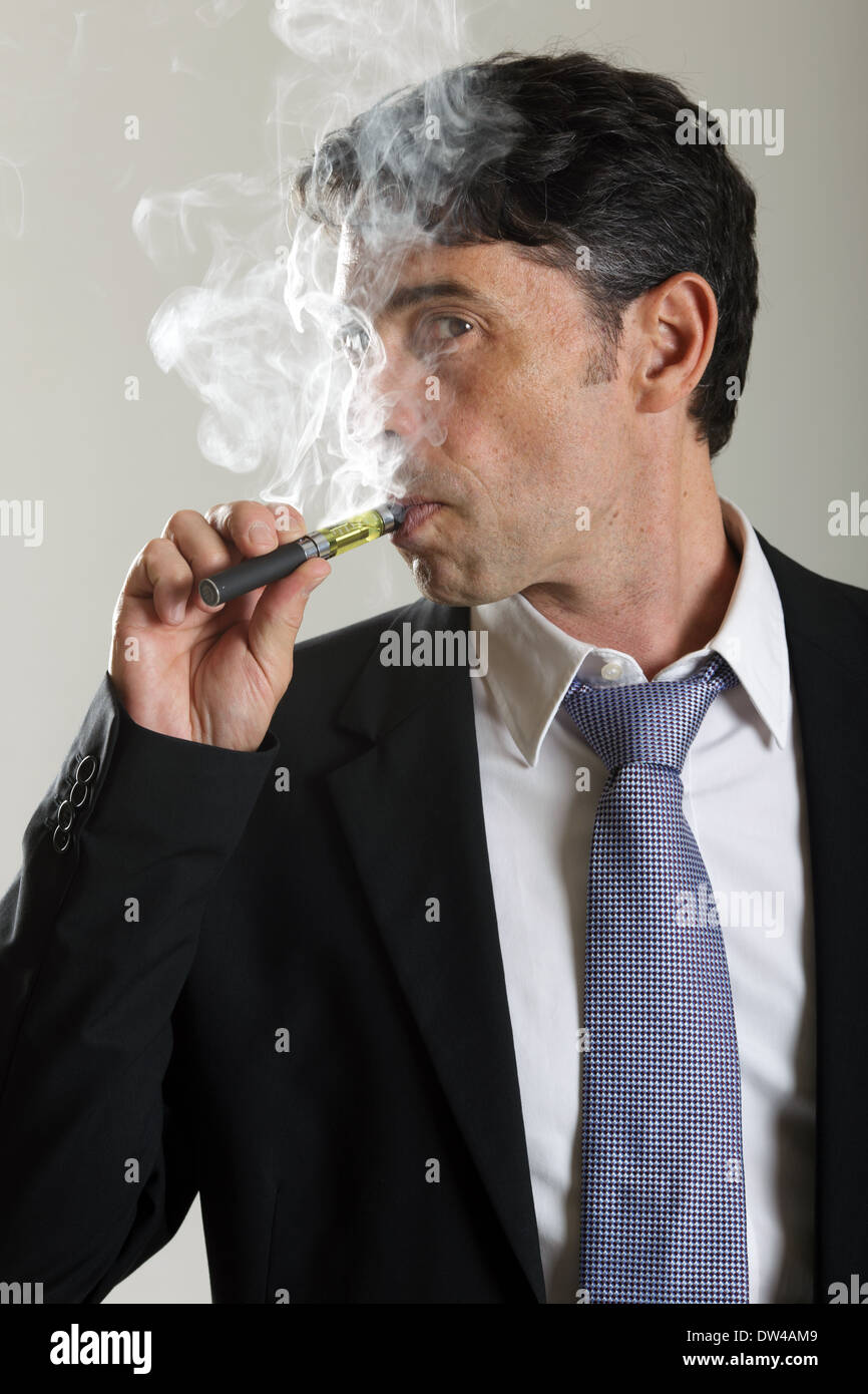 Man smoking electronic cigarette Stock Photo