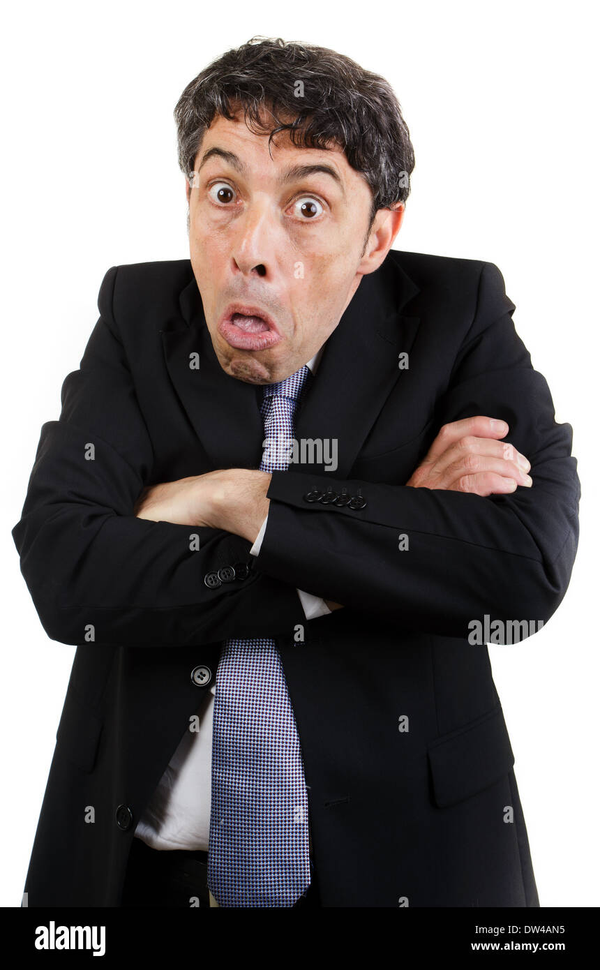 Mature business shrugging his shoulders to show his ignorance or indifference in an uncaring attitude isolated on white Stock Photo