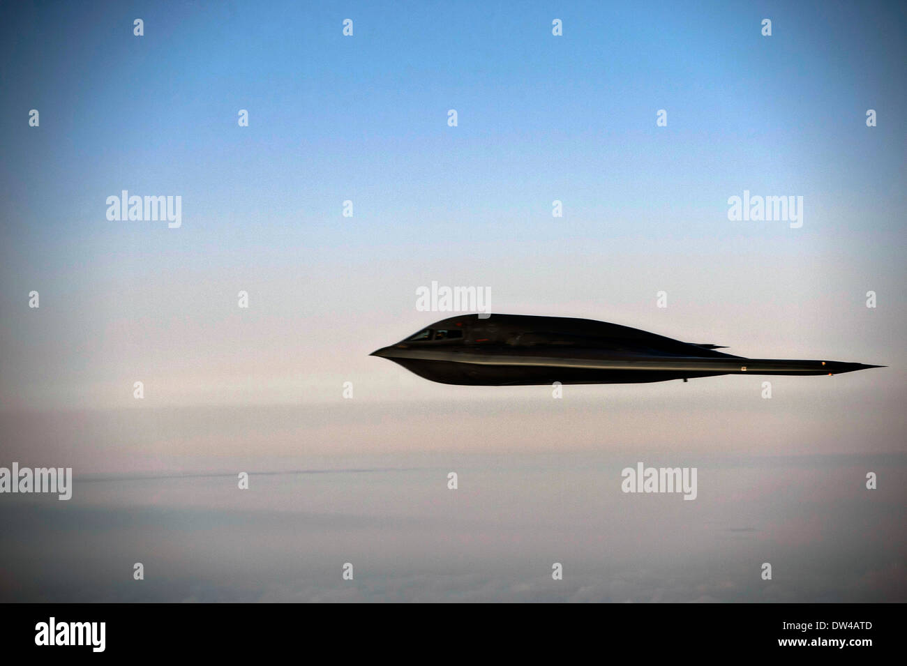 A US Air Force B-2 Spirit stealth bomber aircraft flies over Whiteman Air Force Base February 20, 2014 in Knob Noster, MO. Stock Photo