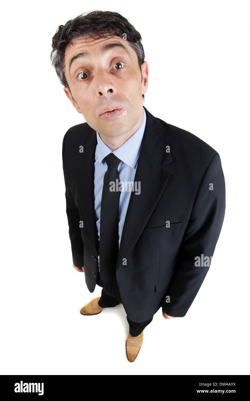 Fun high angle portrait of a middle-aged businessman with a wide eyed inquiring expression or a look of supercilious mockery Stock Photo