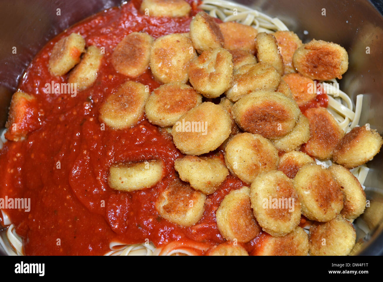 Spaghetti with chicken nuggets and pasta sauce Stock Photo - Alamy