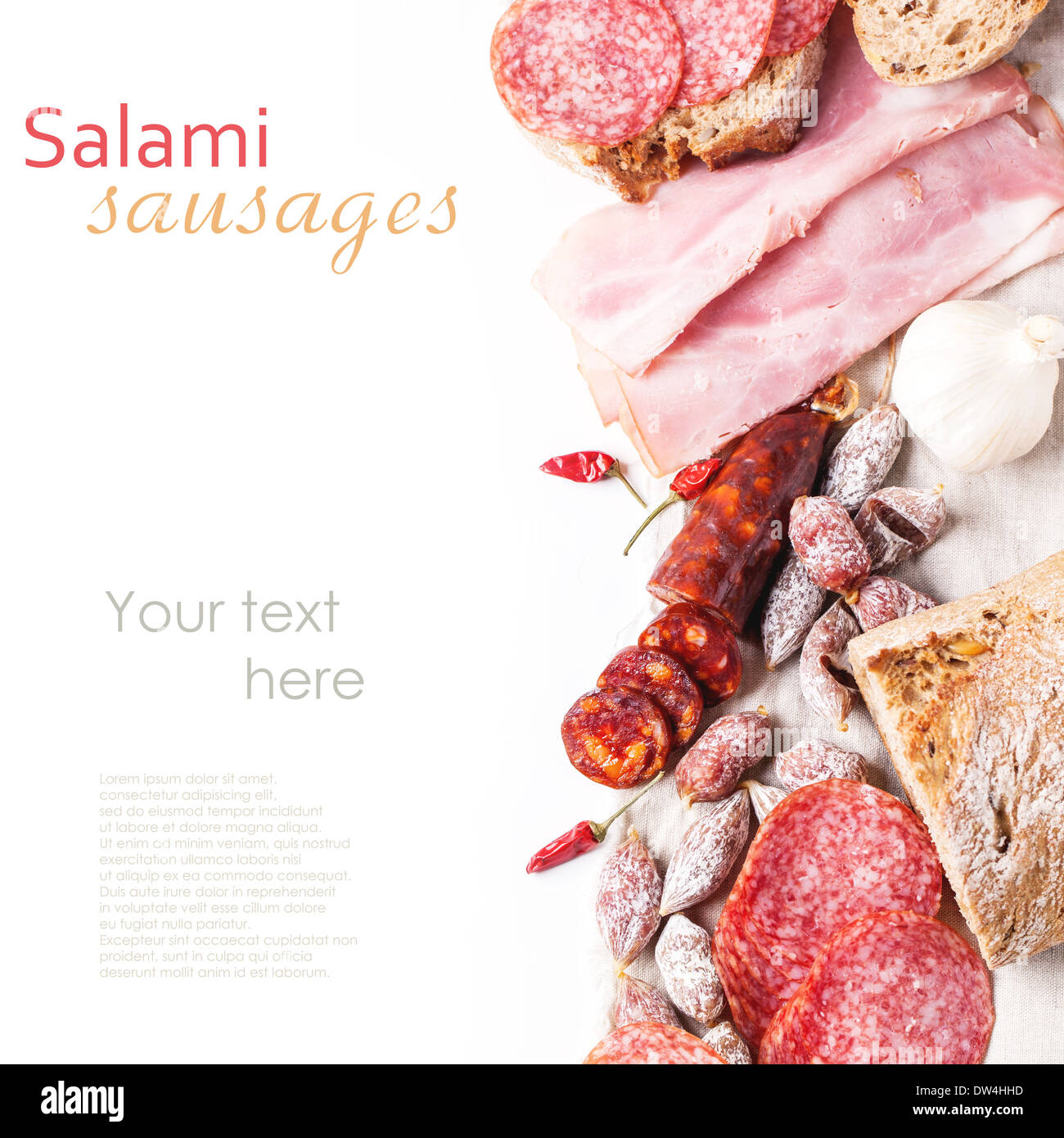 Top view on set of ham and salami sausages served with fresh bread