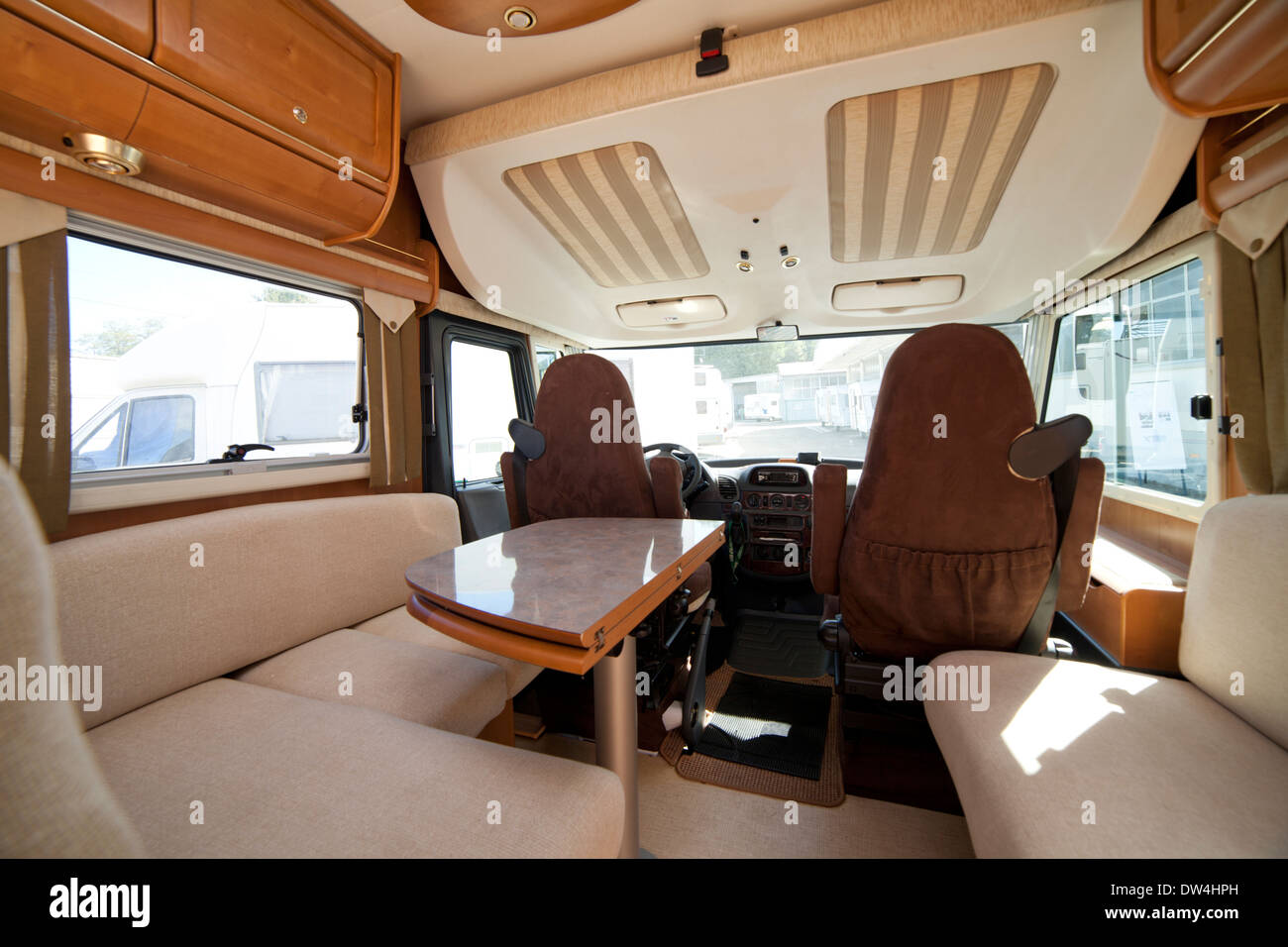 Camper van mobile home front part interior with table and seats Stock Photo