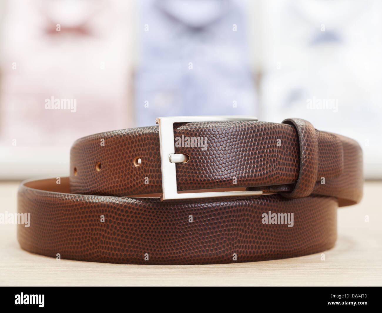 Men Leather Belt with Silver Buckle in mens apparel store Stock Photo