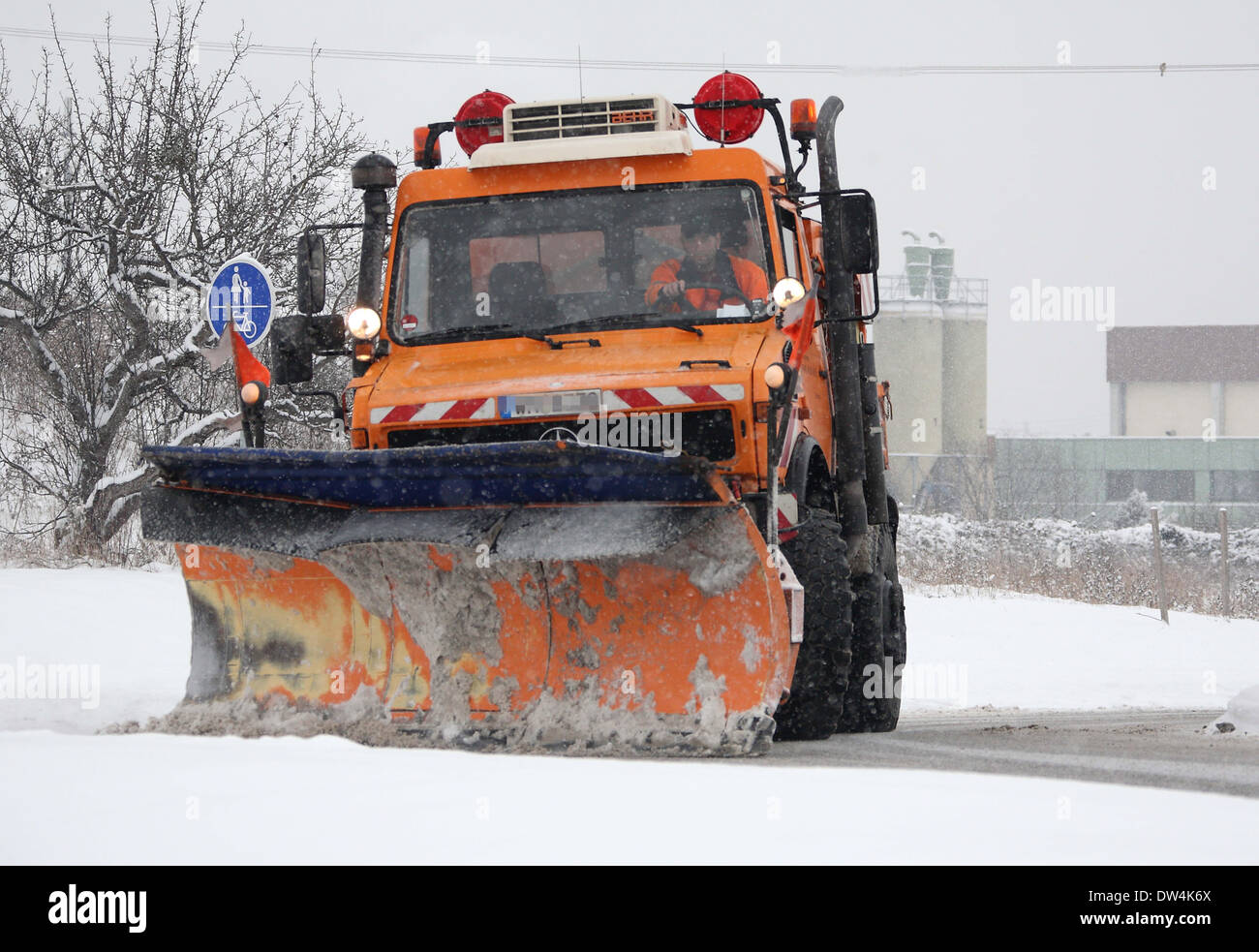 Mercedes Unimog snow plow in action, Winnenden, Germany, Febr. 12, 2010 ...