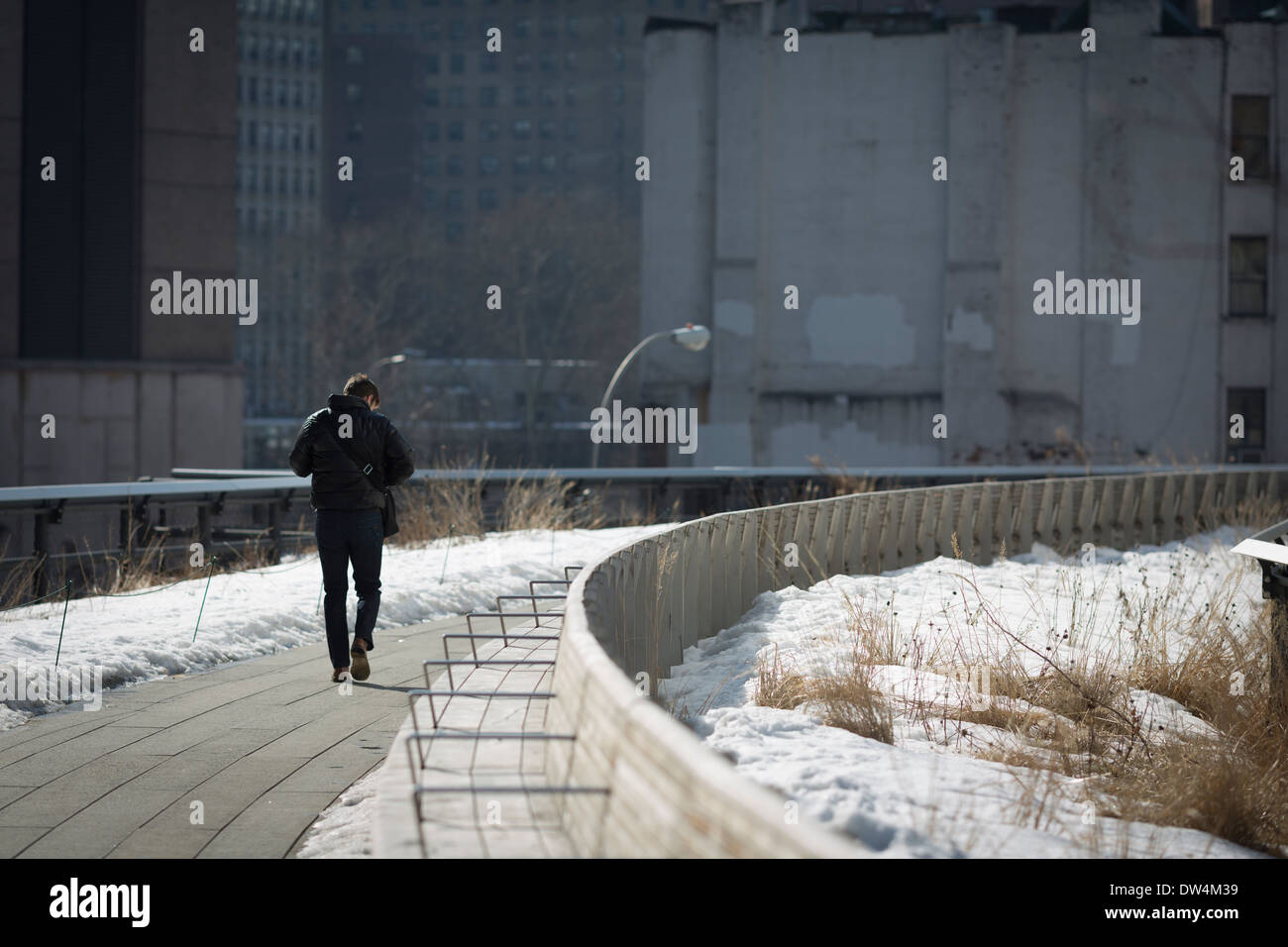 Manhattan New York city in North America, Pictured man walking along the start of the High Line on 30th Street Stock Photo