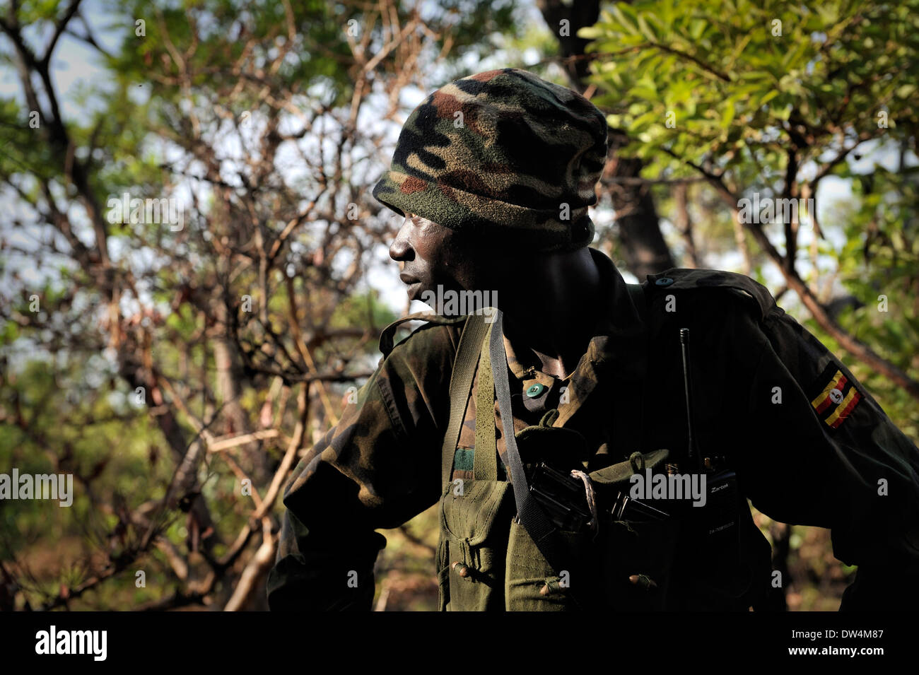 Ugandan soldiers of the Uganda People's Defence Force (UPDF) patrol through the Central African jungle during an operation to hunt notorious Lord's Resistance Army (LRA) leader Joseph Kony. The LRA is a Christian militant rebel group. Stock Photo