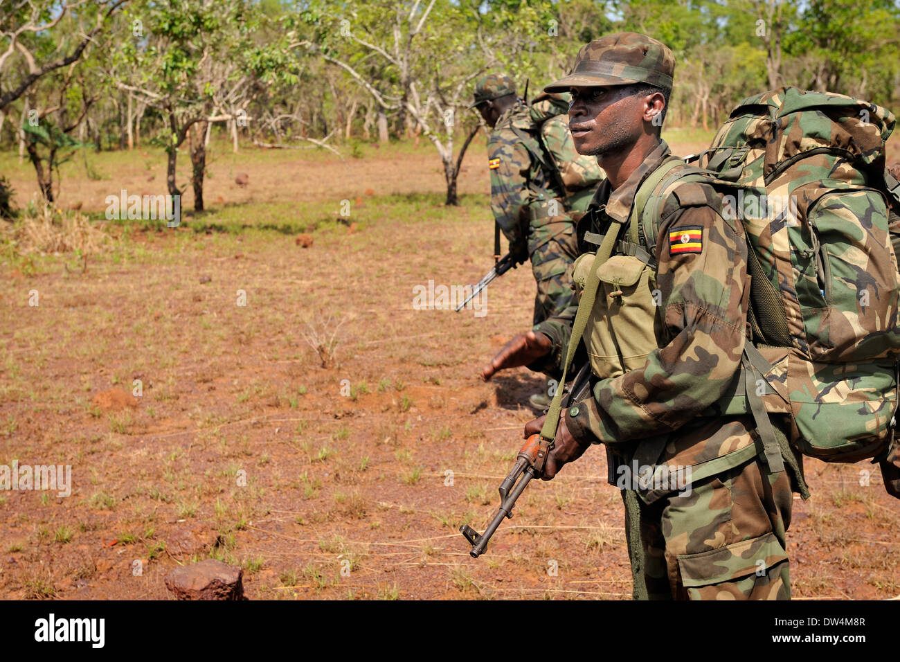 Ugandan soldiers of the Uganda People's Defence Force (UPDF) patrol through the Central African jungle during an operation to hunt notorious Lord's Resistance Army (LRA) leader Joseph Kony. The LRA is a Christian militant rebel group. Stock Photo