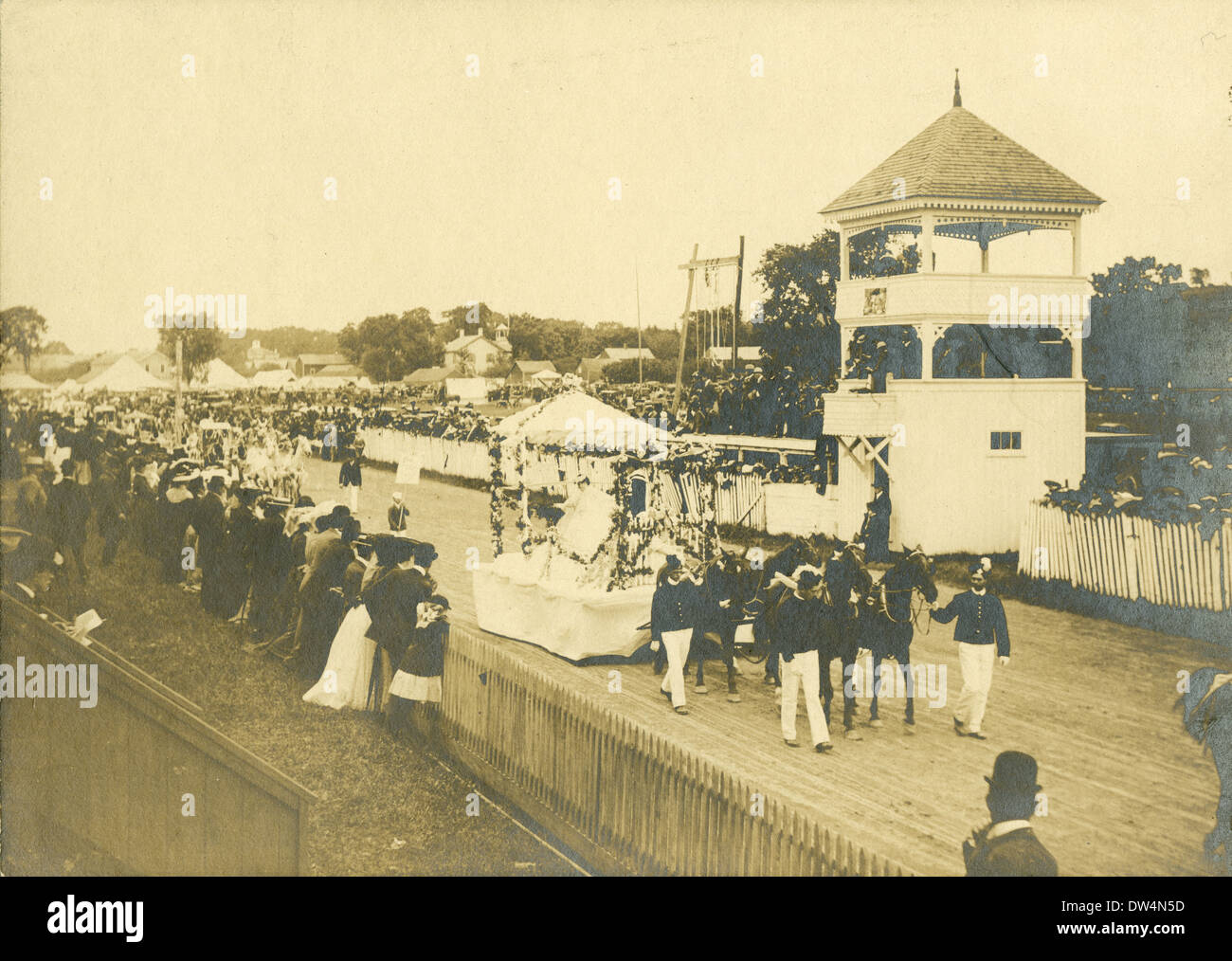 Antique photograph, circa 1900, fancy horse parade on a race track, perhaps a May Day celebration, USA. Stock Photo