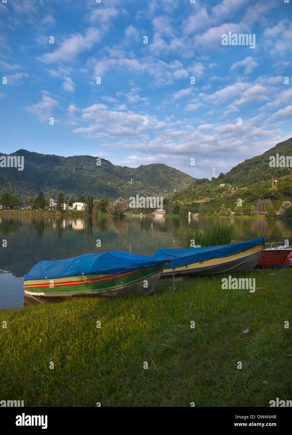 Boats on the Shore of Lake Idro, Idro, Brescia, Lombardy, Italy Stock Photo