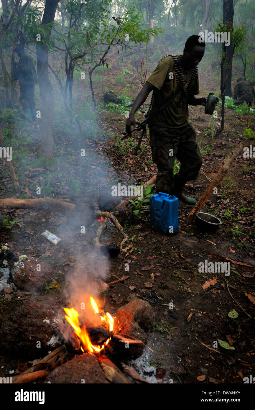 Ugandan soldiers of the Uganda People's Defence Force (UPDF) patrol through the Central African jungle during an operation to hunt notorious Lord's Resistance Army (LRA) leader Joseph Kony. The LRA is a Christian militant rebel group. Stock Photo