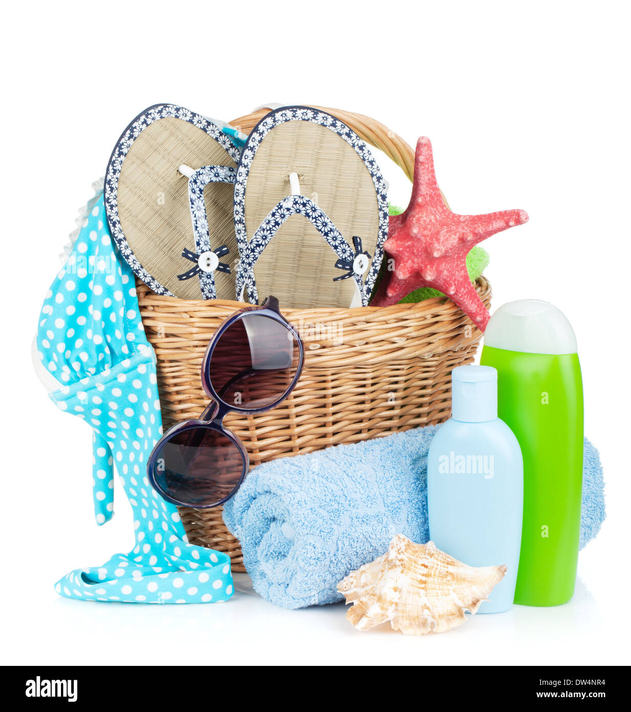 Beach items in basket. Isolated on white background Stock Photo