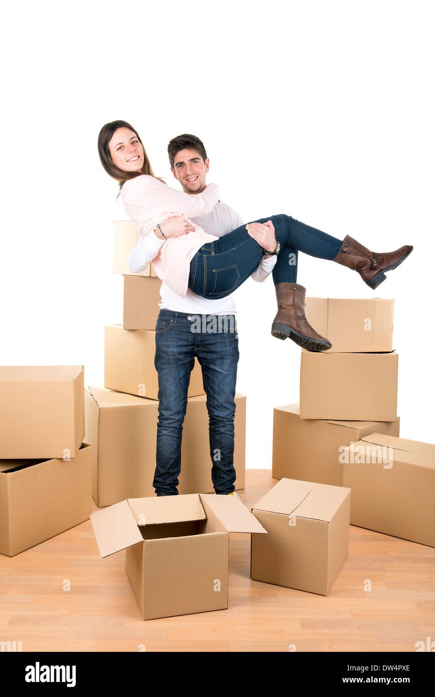 Happy couple with boxes moving into new home apartment Stock Photo - Alamy