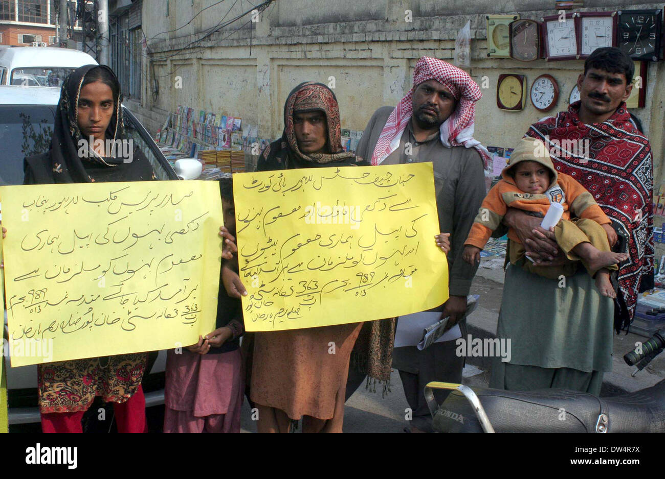 Residents of Khanpur are protesting against kidnapping of their daughters Shahzadi Bibi and Tasleem Bibi, during a demonstration at Lahore press club on Thursday, February 27, 2014. Stock Photo