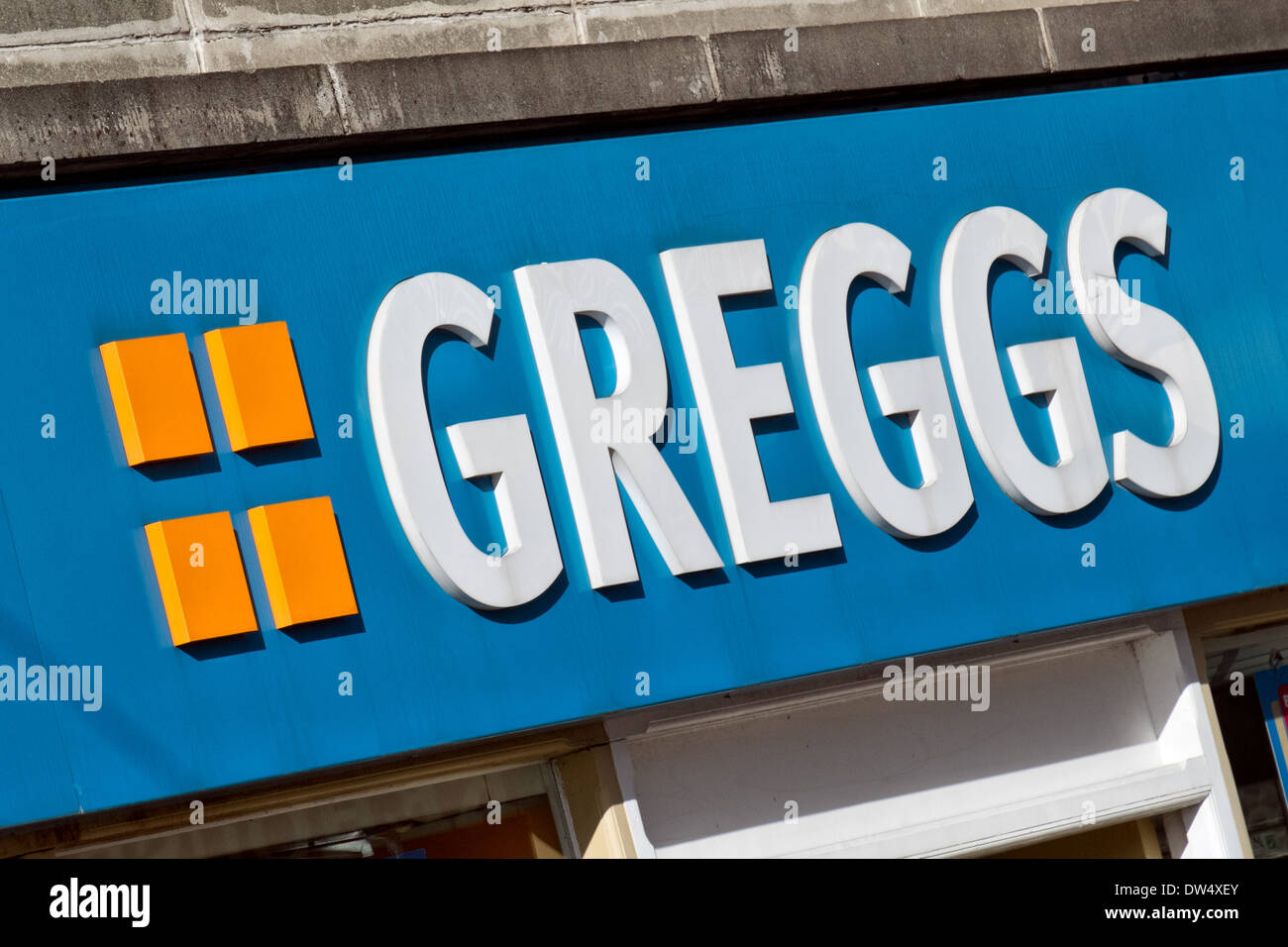 The sign of Greggs bakery, national chain of bakers shops found widely on high streets in the UK Stock Photo