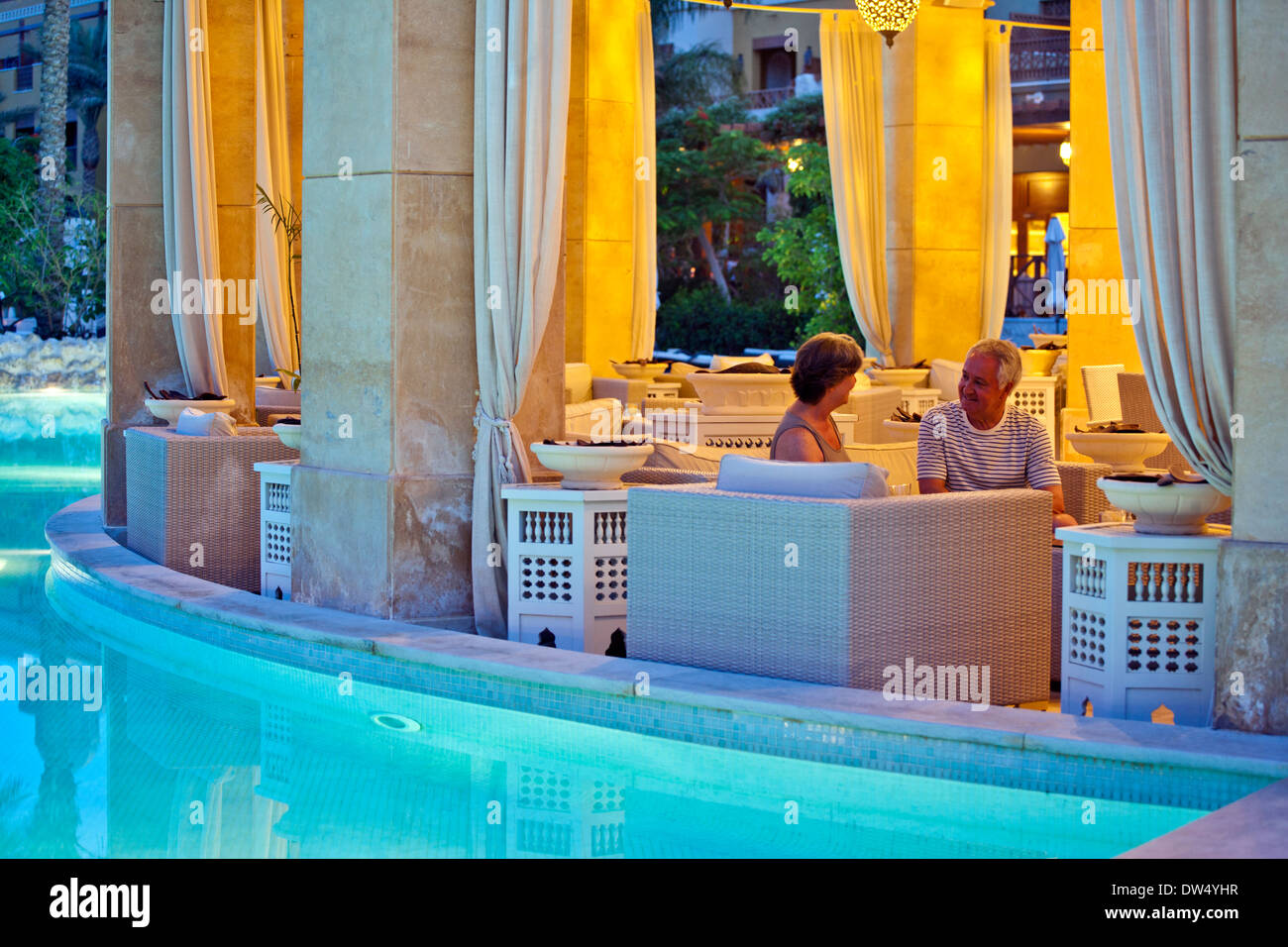 Evening shot of older couple enjoying drinks in The Makadi Spa Hotel Egypt Stock Photo