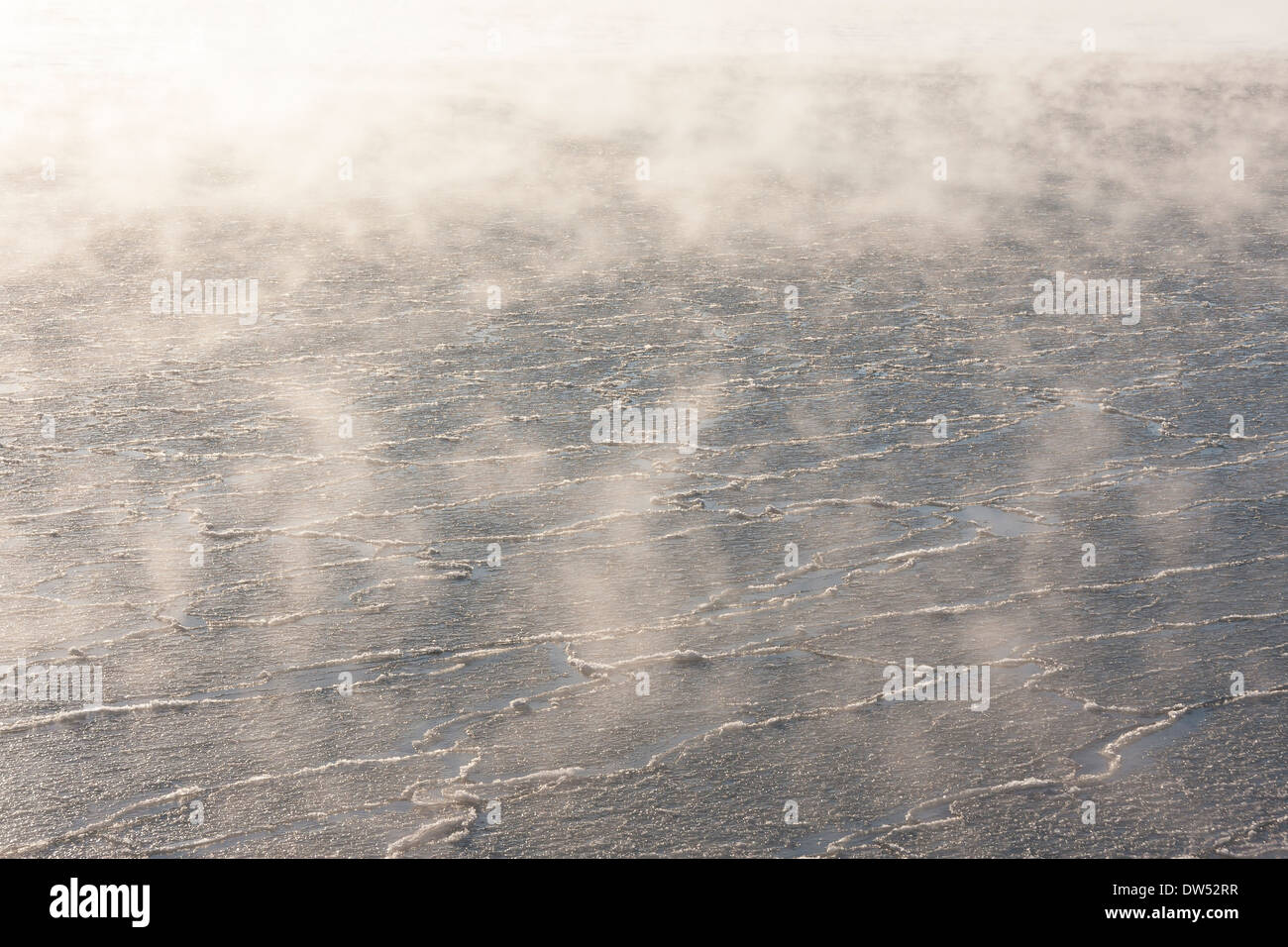 Mist or fog above icy or half frozen water Stock Photo