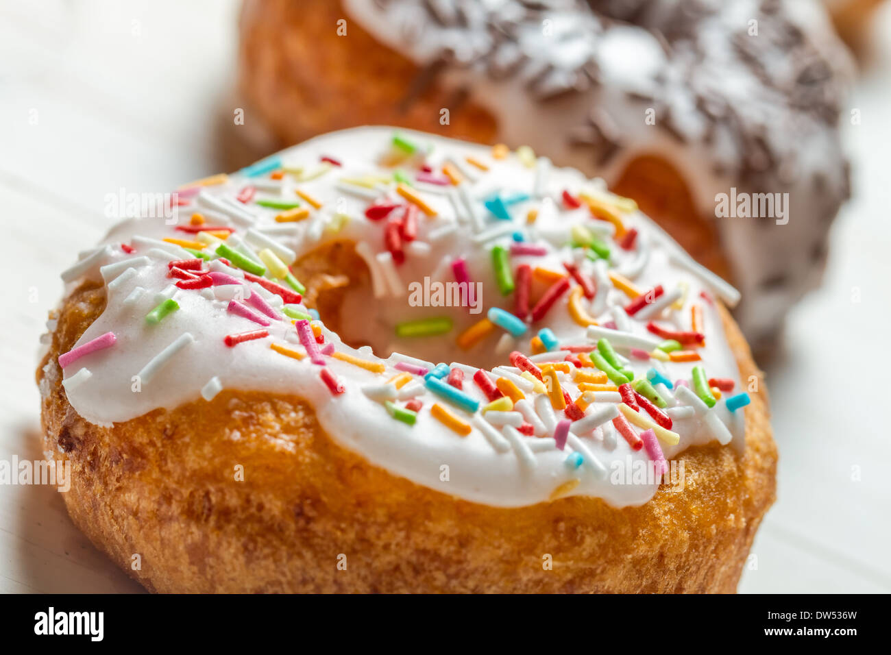 Closeup of freshly baked colorful donuts Stock Photo - Alamy