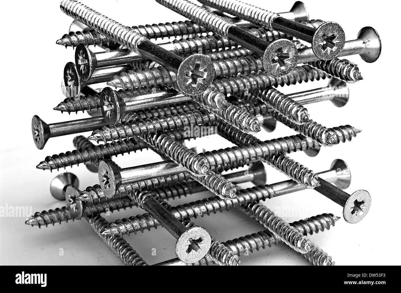Abstract image of timber screws stacked into a pile Stock Photo