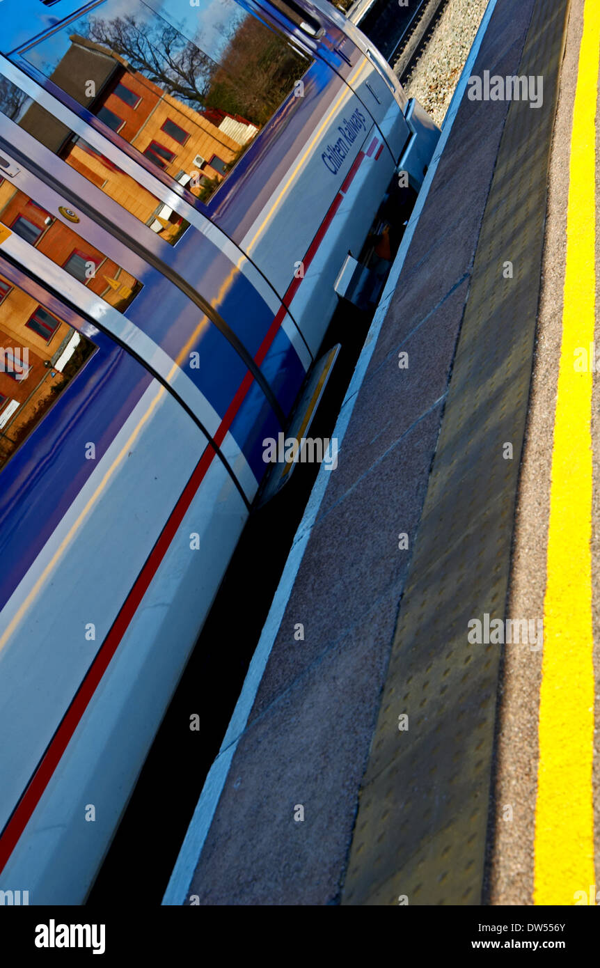 Passenger train waiting in a station platform Stock Photo