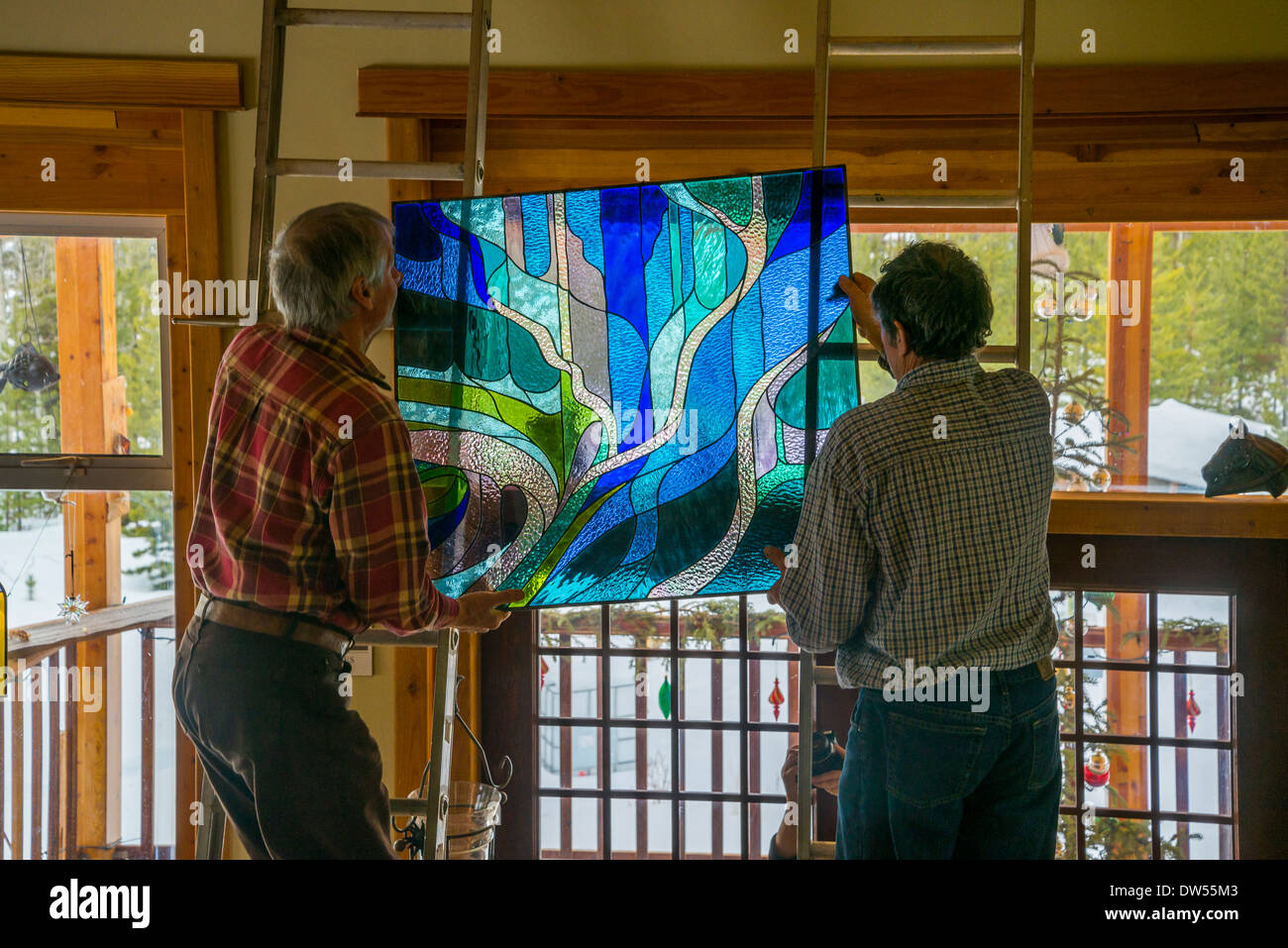 Beautiful stained glass window installation. Designed and crafted by